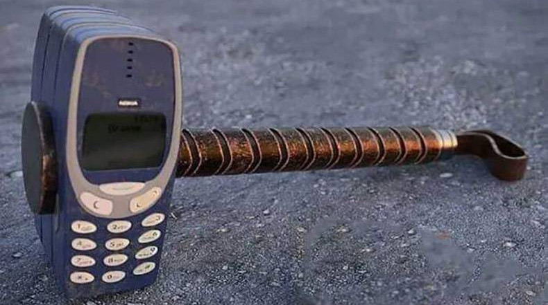 Several Nokia 3310s are strapped together with a handle to create Thor's hammer