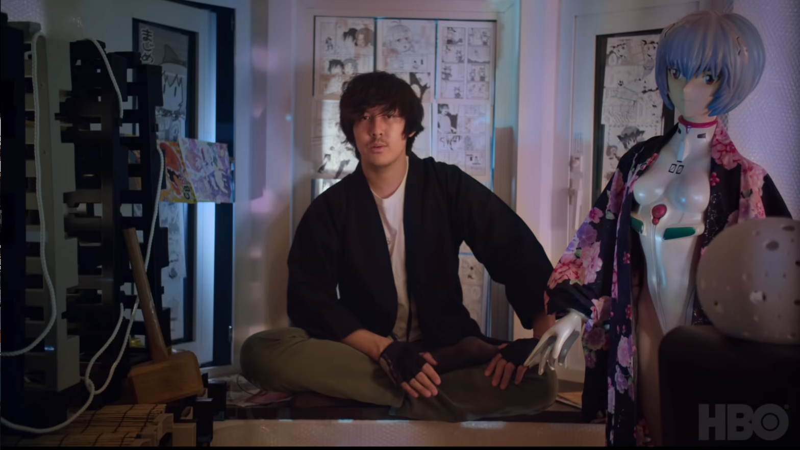 Ron Watkins, the former administrator of fringe message board 8chan and possible candidate for Congress, seen here alongside his life-sized Evangelion doll that is possibly a sex toy. (Screenshot: HBO / Q: Into the Storm / YouTube, Fair Use)