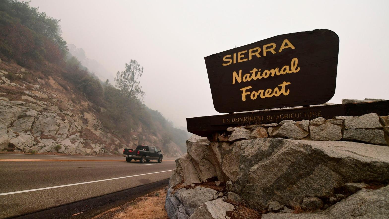 A vehicle entering the Sierra National Forest northeast of Fresno in the foothills of the Sierra Nevada mountains on Sept. 11, 2020, during a forest fire in the area. (Photo: Frederic J. Brown, Getty Images)