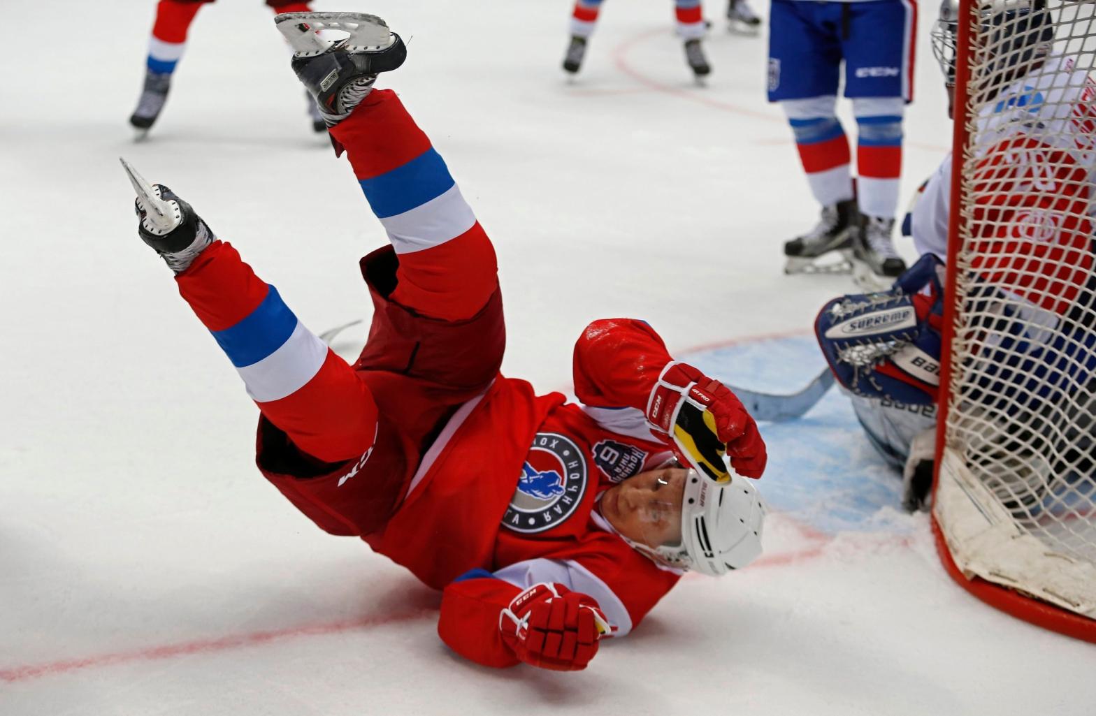 He's too busy playing hockey. (Photo: Yuri Kochetkov/Pool, AP)