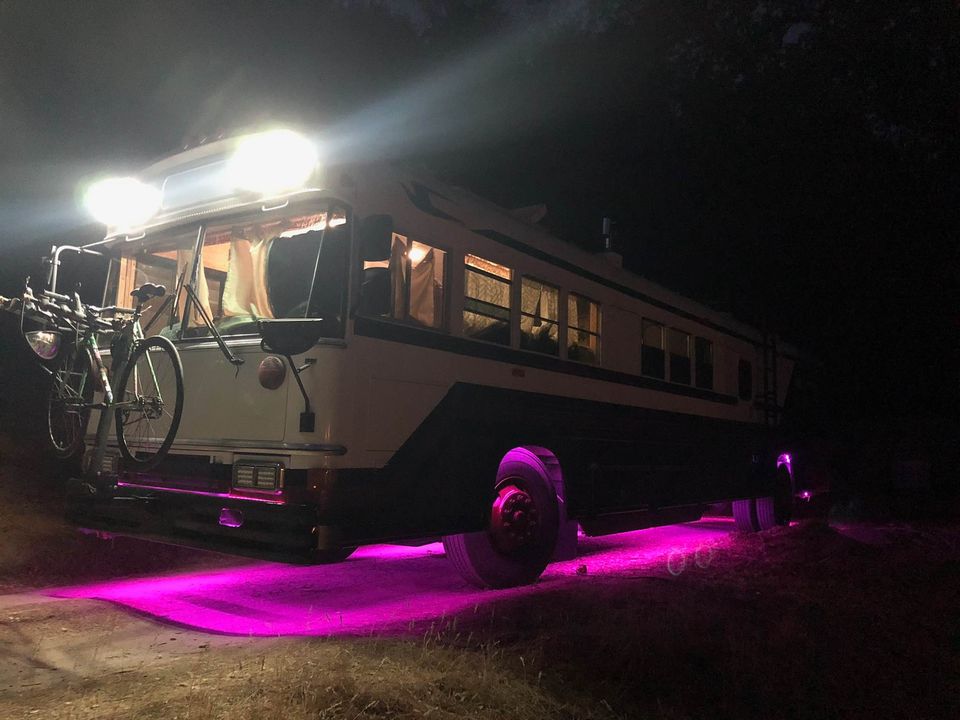 This Wild School Bus RV Has Underglow and a Fire Pit on Its Roof