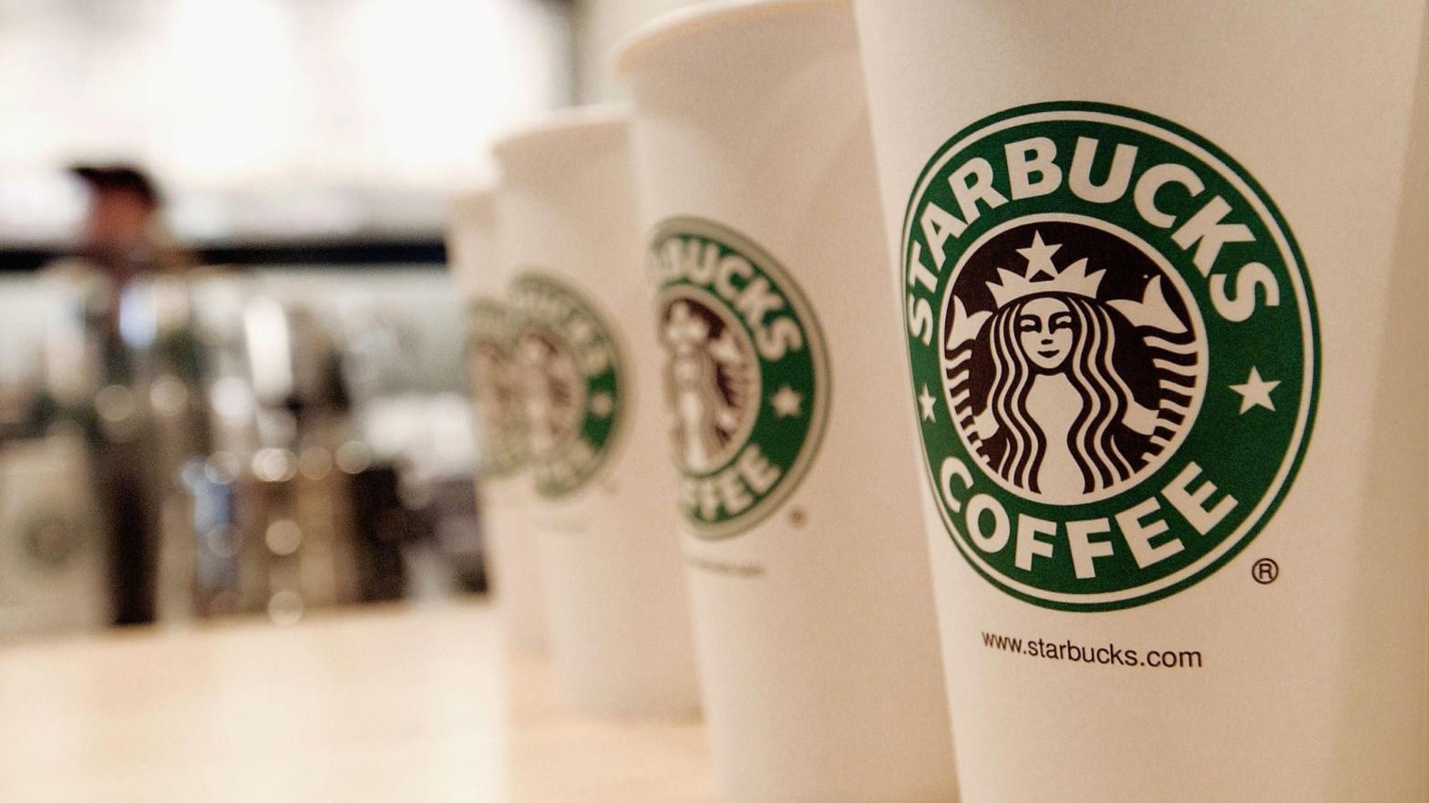 Beverage cups featuring the logo of Starbucks Coffee. (Photo: Stephen Chernin, Getty Images)