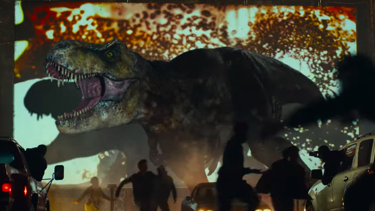 A t-rex scaring the mess out of a bunch of moviegoers. (Screenshot: Universal)