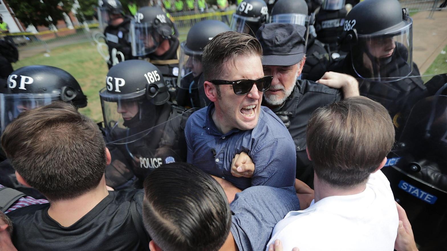 White supremacist Richard Sspencer, seen here as he and his supporters fight with Virginia State Police in Charlottesville, Virginia's Emancipaton Park after Unite the Right was declared an unlawful gathering on Aug. 12, 2017. (Photo: Chip de Somodevilla, Getty Images)