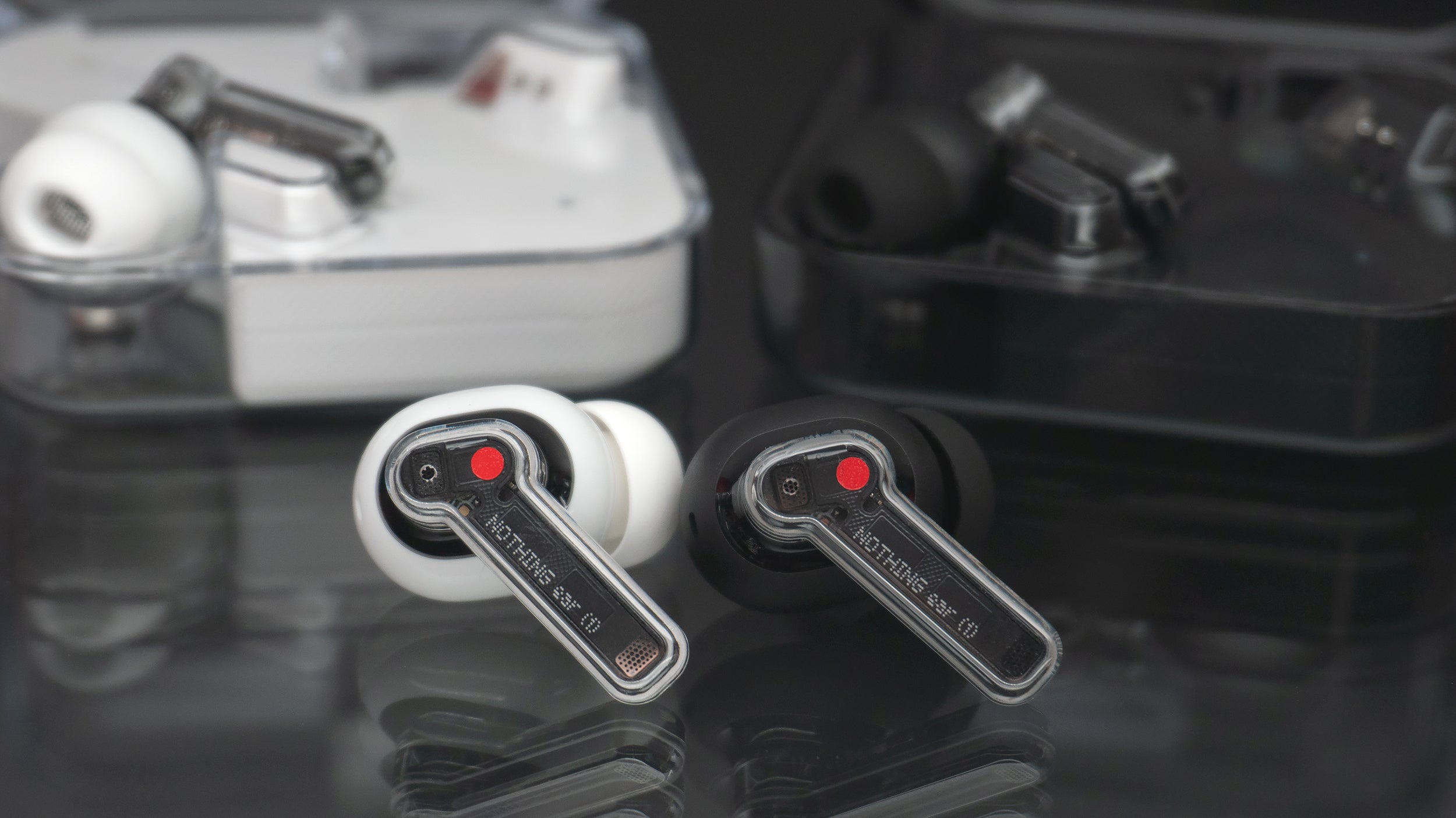 If you're not a fan of the shiny white Apple AirPods aesthetic, the Ear (1) black edition might be a better fit. (Photo: Andrew Liszewski - Gizmodo)