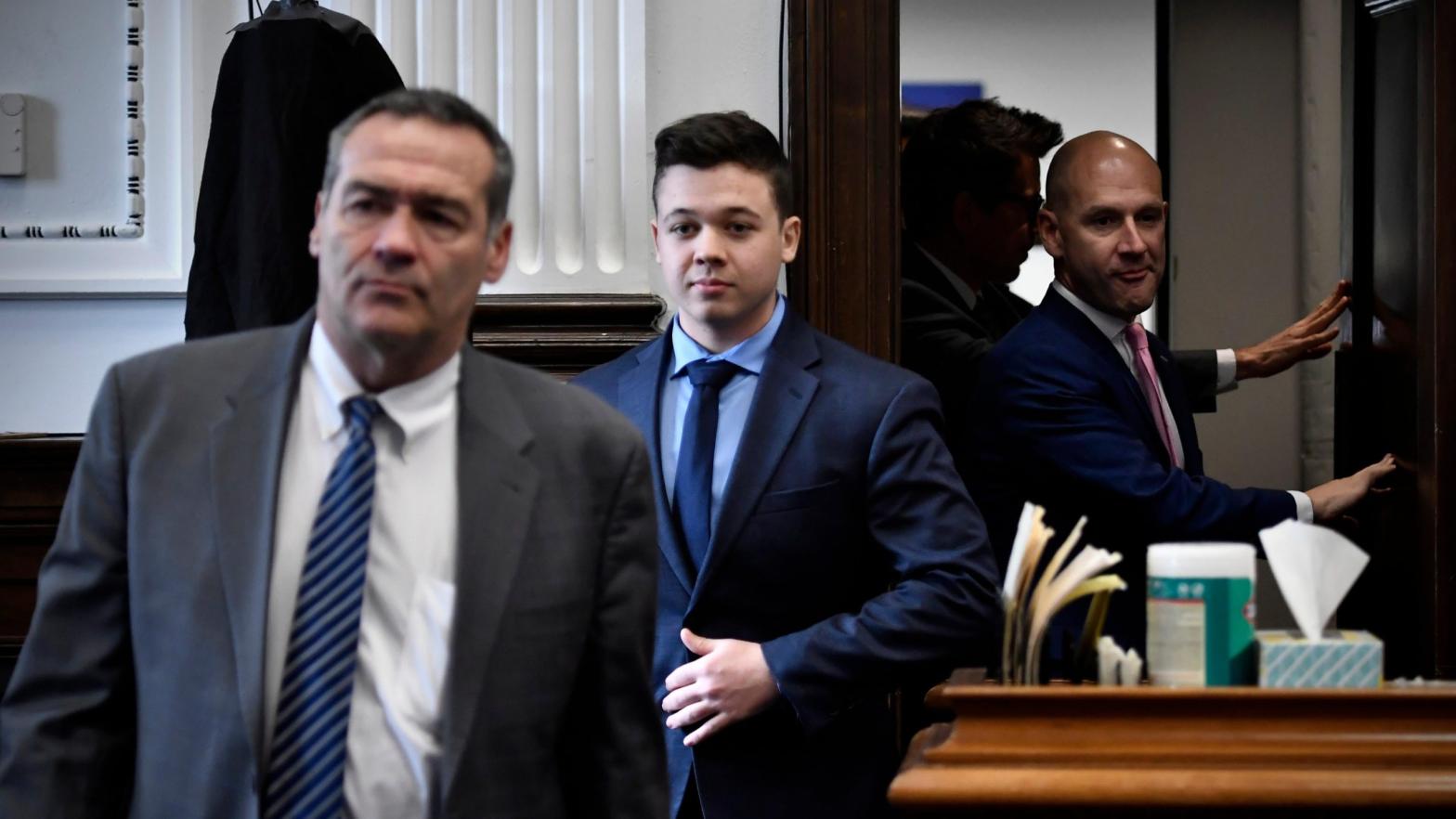 Kyle Rittenhouse, centre, seen between attorneys Mark Richards, left, and Corey Chirafisi, right, as they enter a meeting in the Kenosha County Courthouse on Nov. 18, 2021. (Photo: Sean Krajacic / Pool, Getty Images)