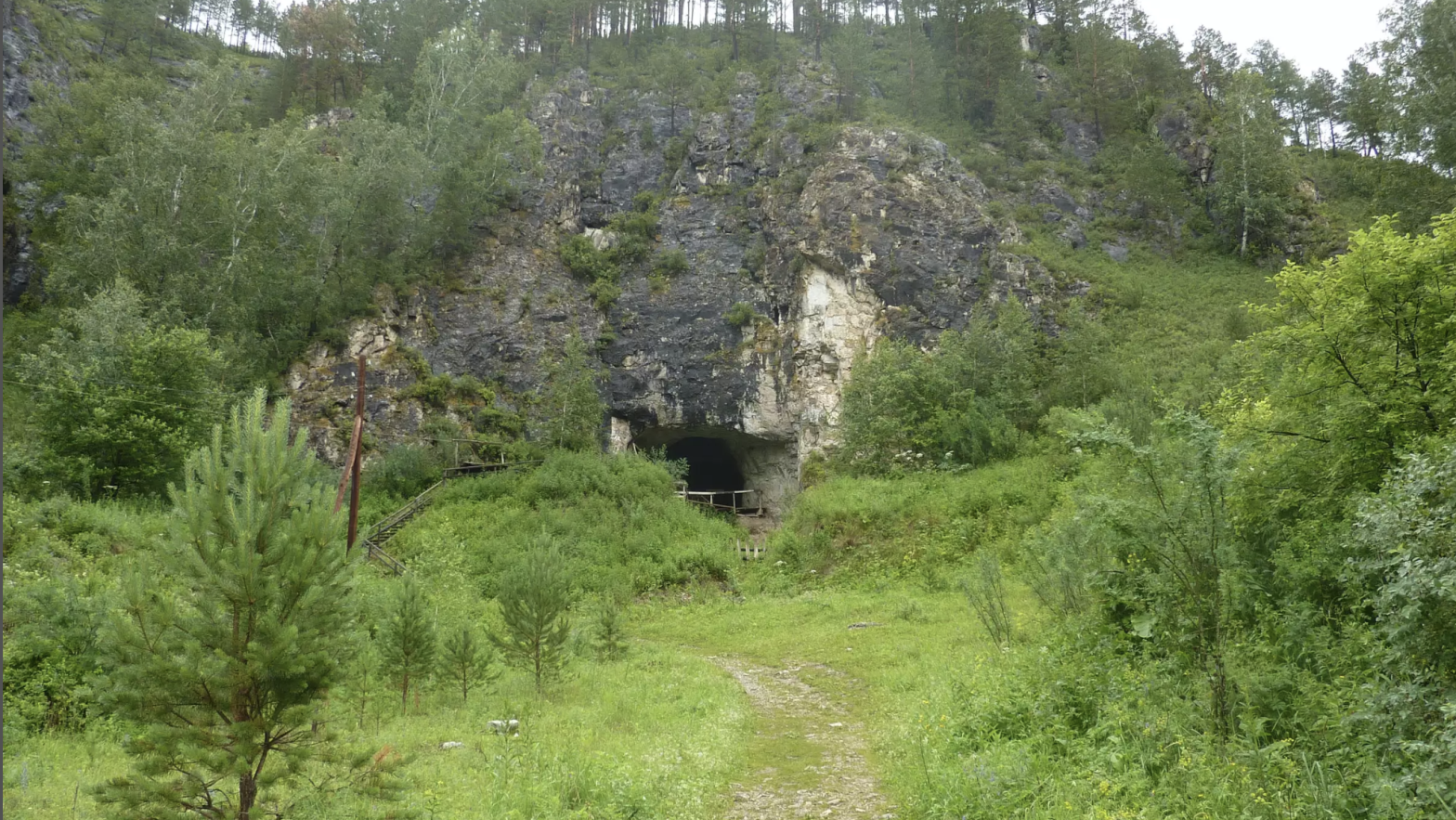 The entrance to Denisova Cave in Sibera.  (Image: IAET, Siberian Branch Russian Academy of Sciences)