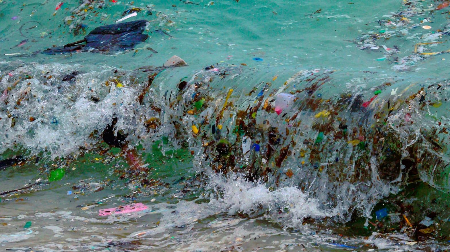 A wave carrying plastic waste and other rubbish washes up on a beach in Koh Samui in the Gulf of Thailand. (Photo: Mladen Antonov/AFP, Getty Images)