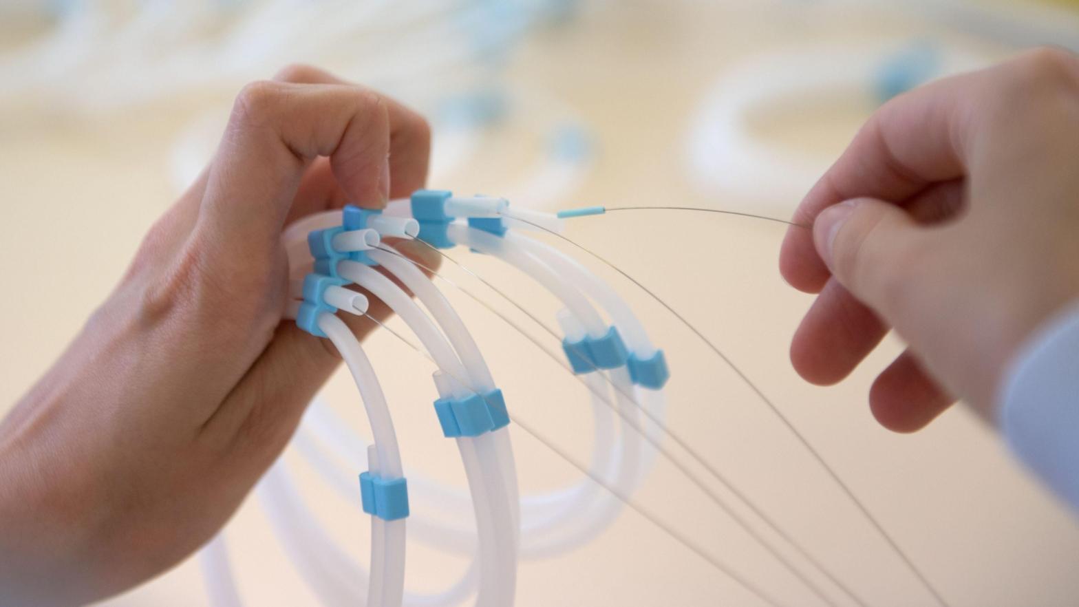 The minimally invasive surgery involves using a catheter to block an artery key to producing ghrelin. Above, an employee assembling catheters. (Photo: GERARD JULIEN/AFP, Getty Images)