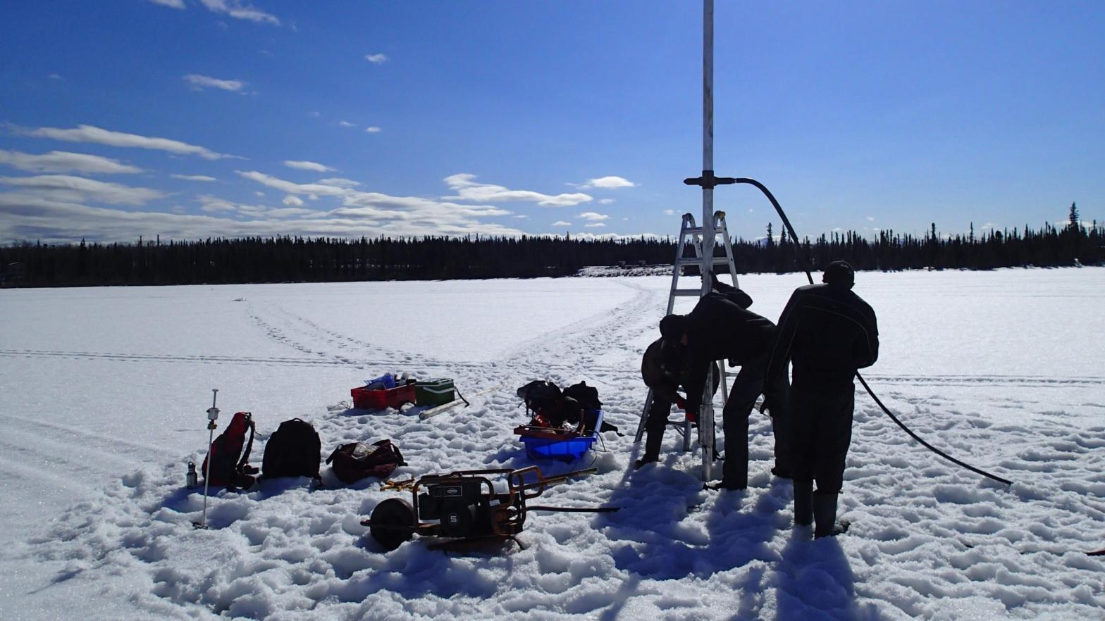 Researchers collect a soil sample in Canada's Yukon. (Photo: Tyler Murchie)