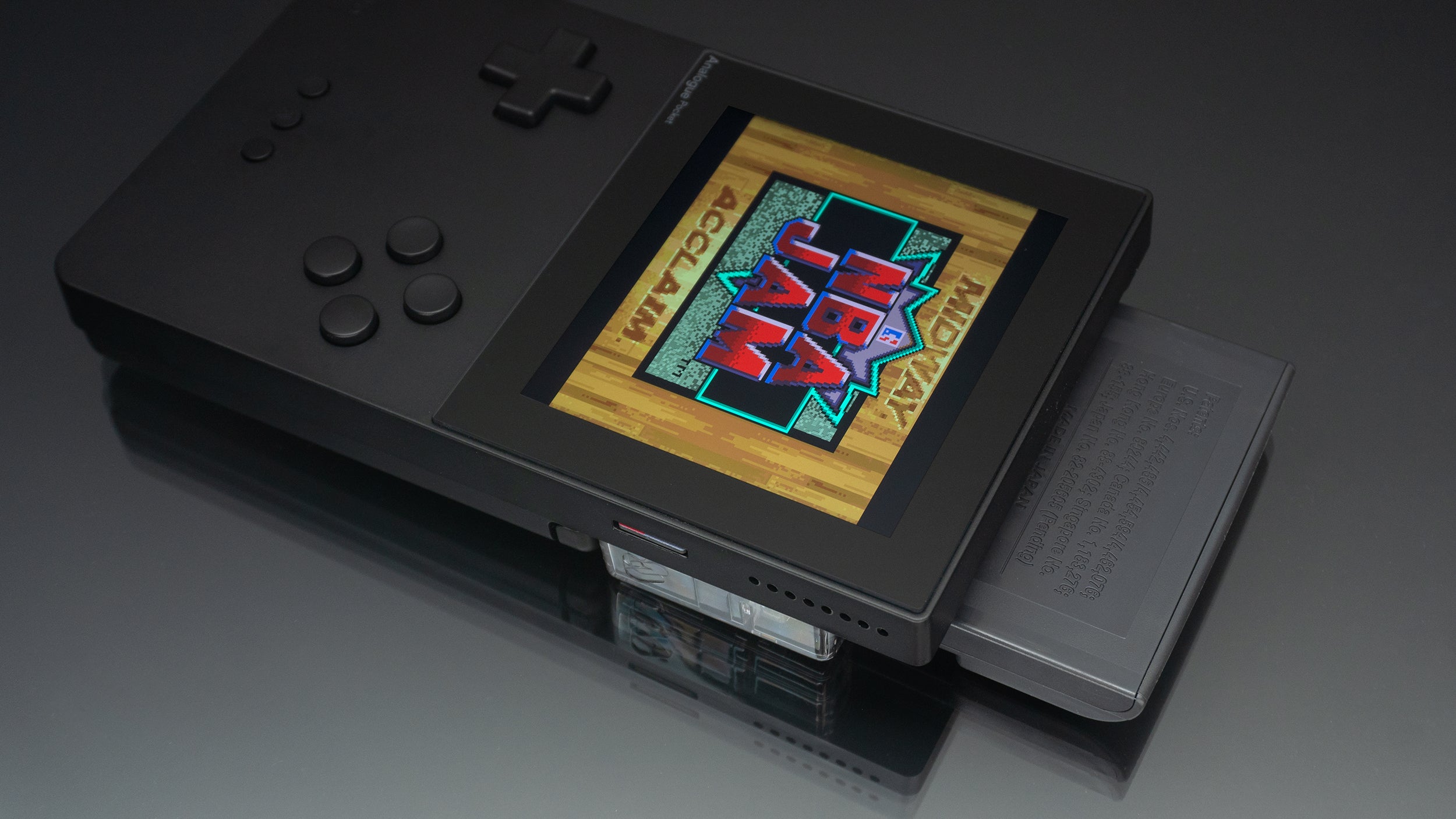 In the case of Sega Game Gear games, the Pocket's cartridge adaptor leaves them over-hanging the top of the Pocket quite a bit, to the point where it limits portability. (Photo: Andrew Liszewski/Gizmodo)