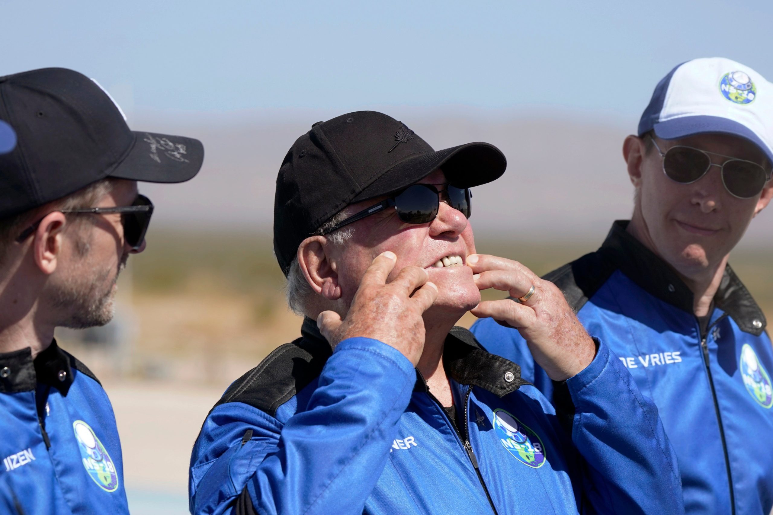 William Shatner (centre) describing what the g-forces did to his face during launch. Entrepreneur Glen de Vries (right) was tragically killed in a plane crash several weeks later. (Photo: LM Otero, AP)