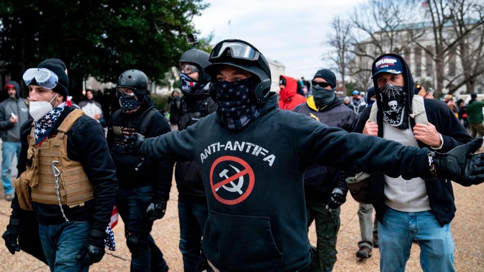 A protester who declared himself to be a member of the Proud Boys, centre, seen here amid other Donald Trump supporters outside the Capitol on Jan. 6. (Photo: Alex Edelman / AFP, Getty Images)