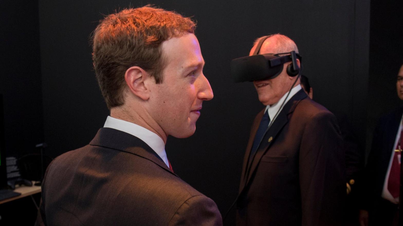 Facebook founder Mark Zuckerberg, seen here alongside Peruvian President Pedro Pablo Kuczynski trying on an Oculus headset at Facebook's booth at the Asia-Pacific Economic Corporation Summit in Lima in November 2016. (Photo: Pablo Porciuncula / AFP, Getty Images)