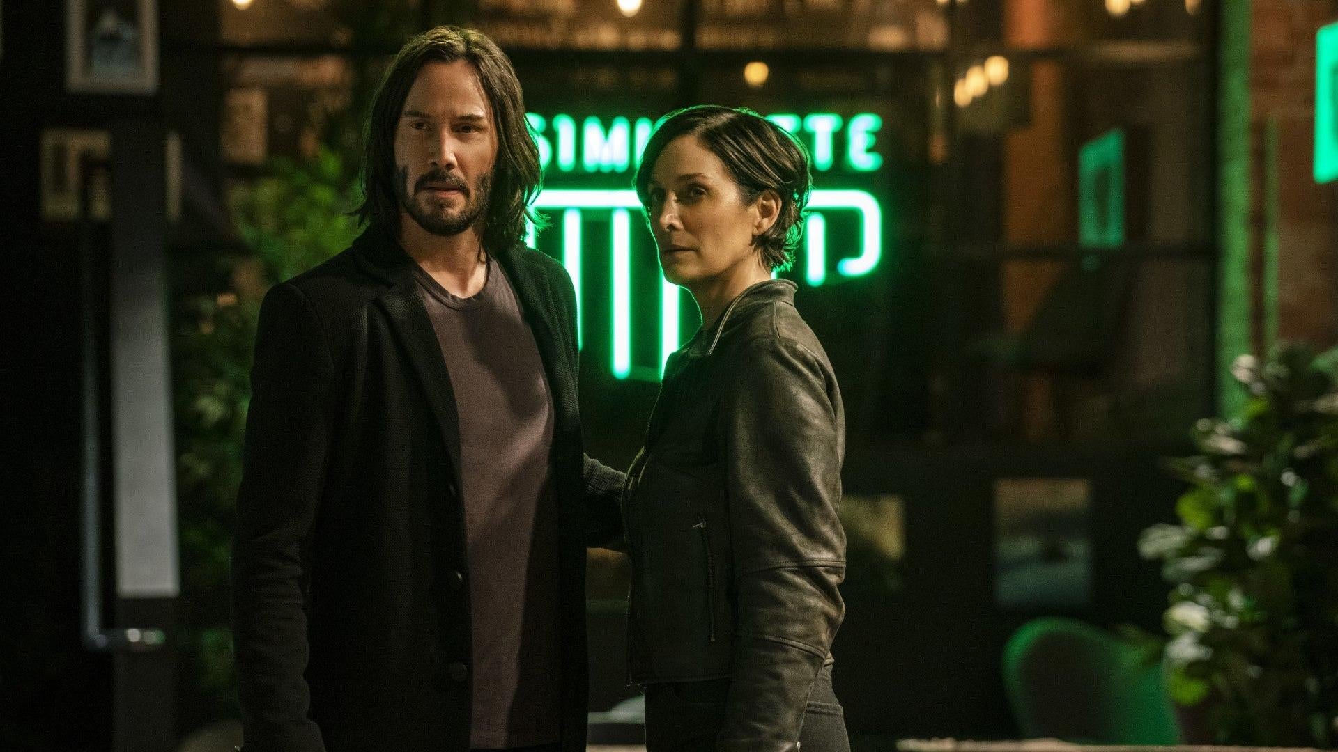 Neo and Trinity, now older, begin to put together the pieces. (Image: Warner Bros.)
