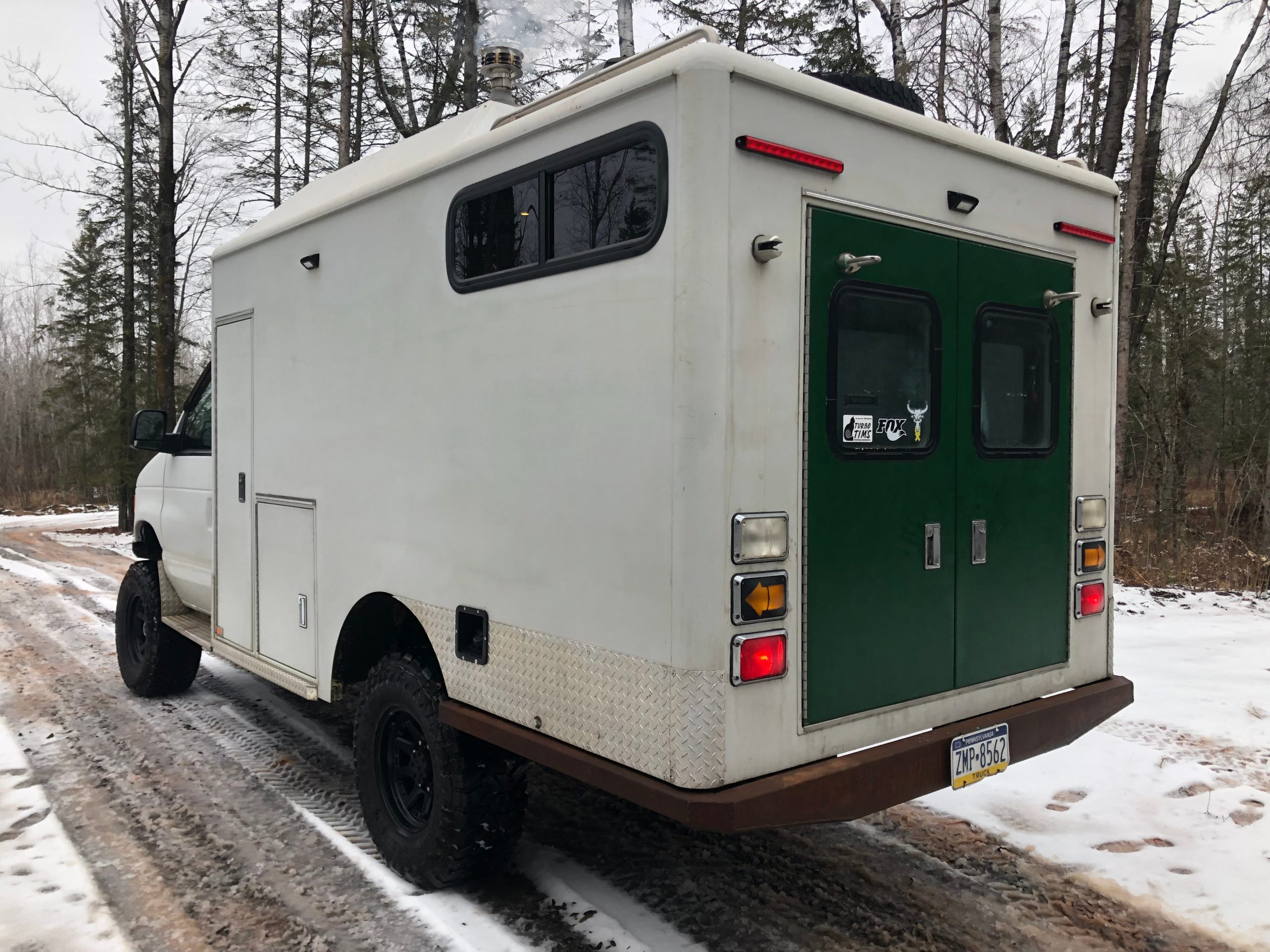 This Ford E-350 Ambulance Traded Its Lights and Sirens for a Lift Kit and Camper Conversion