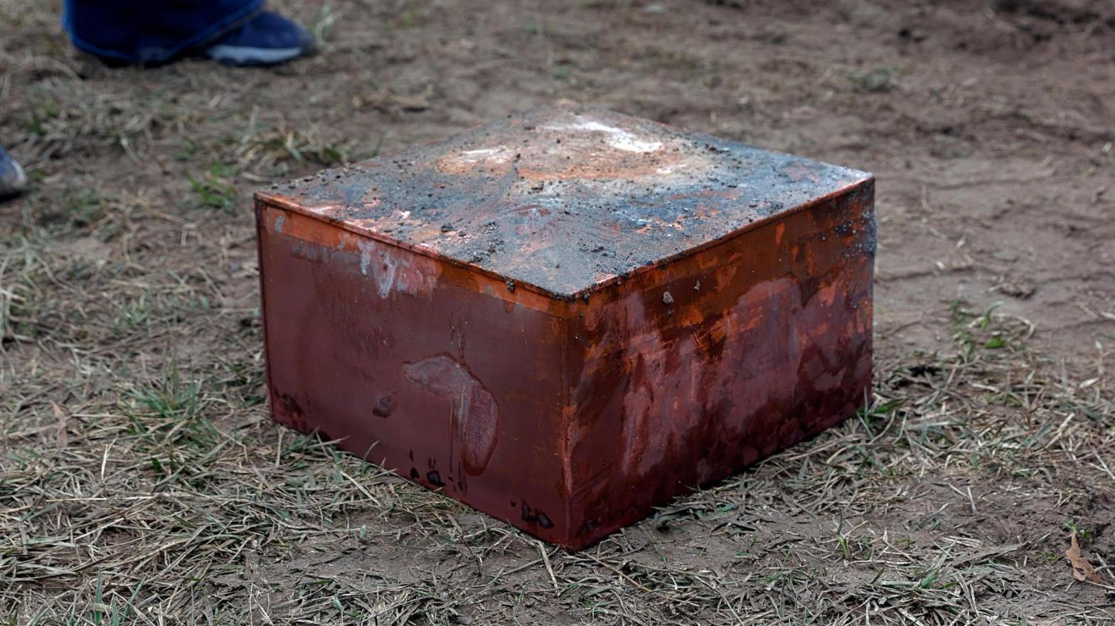 Workers recover a box believed to be the 1887 time capsule that was put under Confederate Gen. Robert E. Lee's statue pedestal in Richmond, Va., Dec. 27, 2021. (Photo: Eva Russo/Richmond Times-Dispatch, AP)
