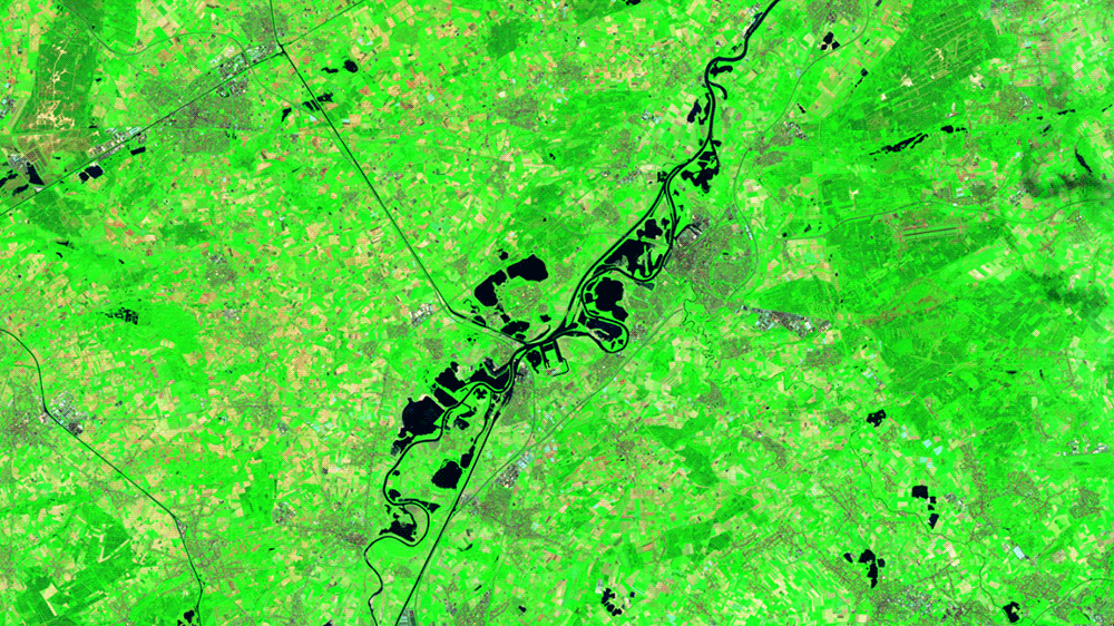 Before and after images show flooding in one corner of the Netherlands using special satellite bands. (Gif: NASA Earth Observatory)