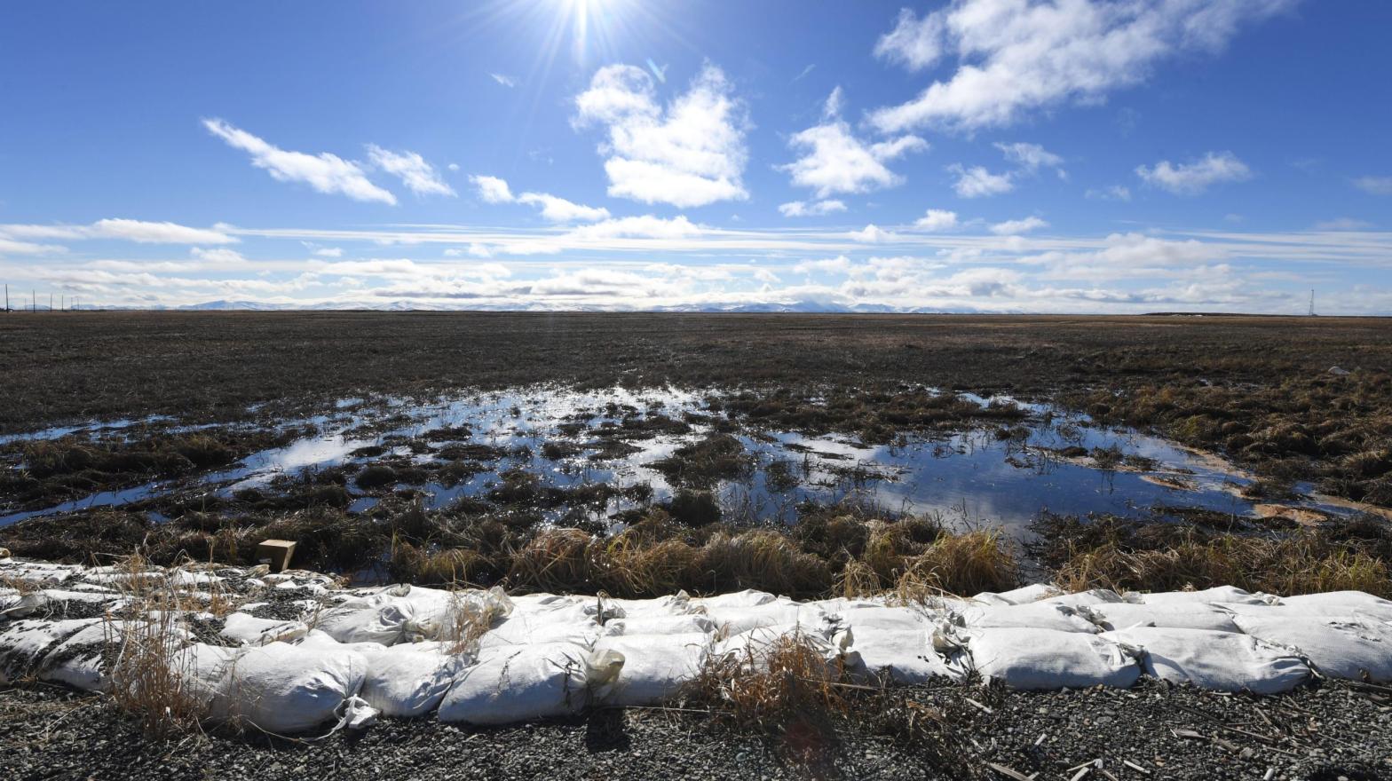 Melting permafrost tundra at the town of Quinhagak on the Yukon Delta in Alaska on April 12, 2019.  (Photo: Mark Ralston, Getty Images)
