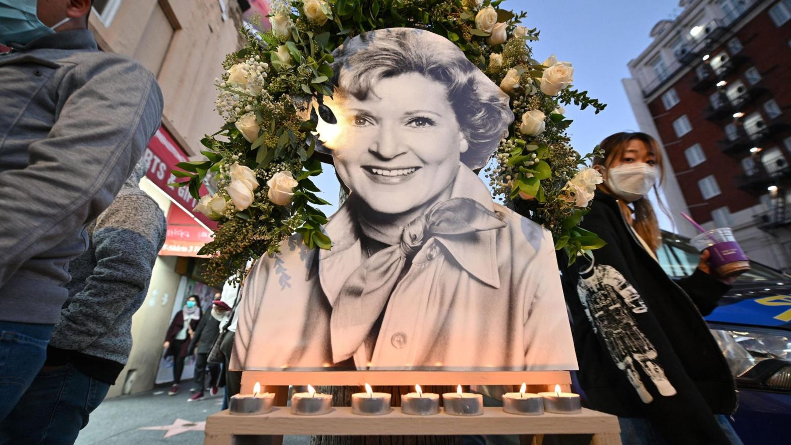 Candles burn at a memorial to late actress Betty White next to her star on the Hollywood Walk of Fame, December 31, 2021 in Hollywood, California. (Photo: Robyn Beck / AFP, Getty Images)