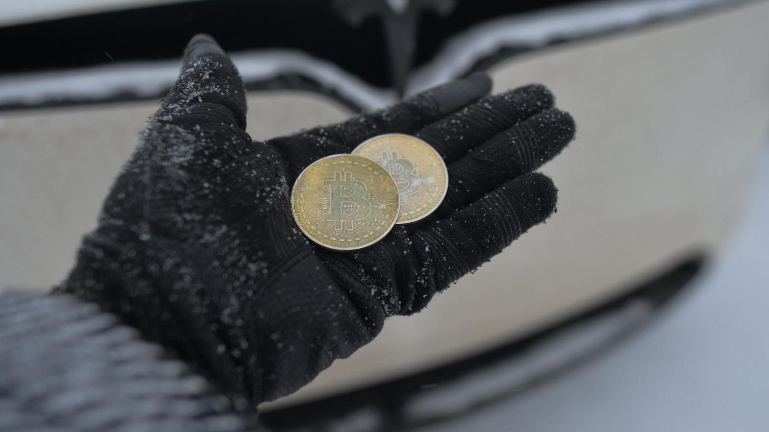 A person holding commemorative physical Bitcoin tokens in Edmonton, Alberta, Canada on Jan. 7, 2022. (Photo: Artur Widak / NurPhoto via Getty Images, Getty Images)