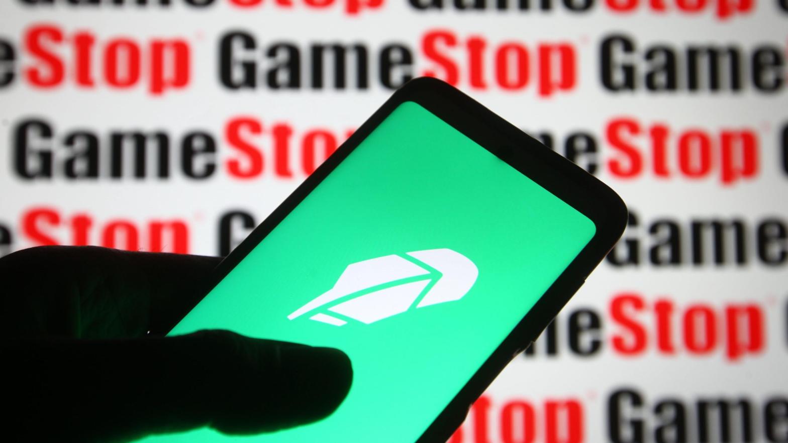 The Robinhood logo displayed in front of the logo of meme stock Gamestop, February 2021.  (Photo: Pavlo Gonchar / SOPA Images / LightRocket via Getty Images, Getty Images)