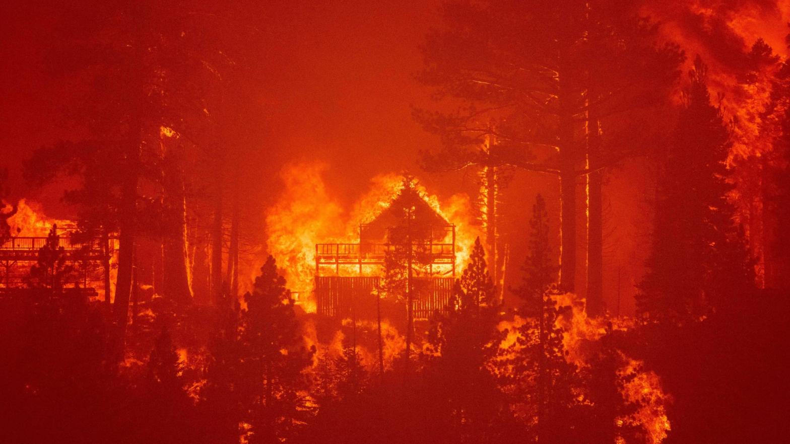 Flames consume multiple homes as the Caldor Fire pushes into the Echo Summit area near Lake Tahoe on Aug. 30, 2021. (Photo: Josh Edelson/AFP, Getty Images)