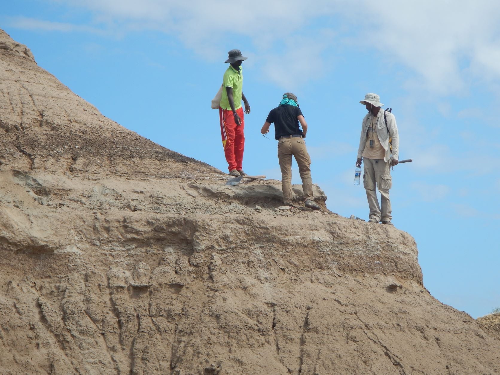 The team sampling ash deposits at the Omo Kibish formation in Ethiopia.  (Photo: Alan Deino)
