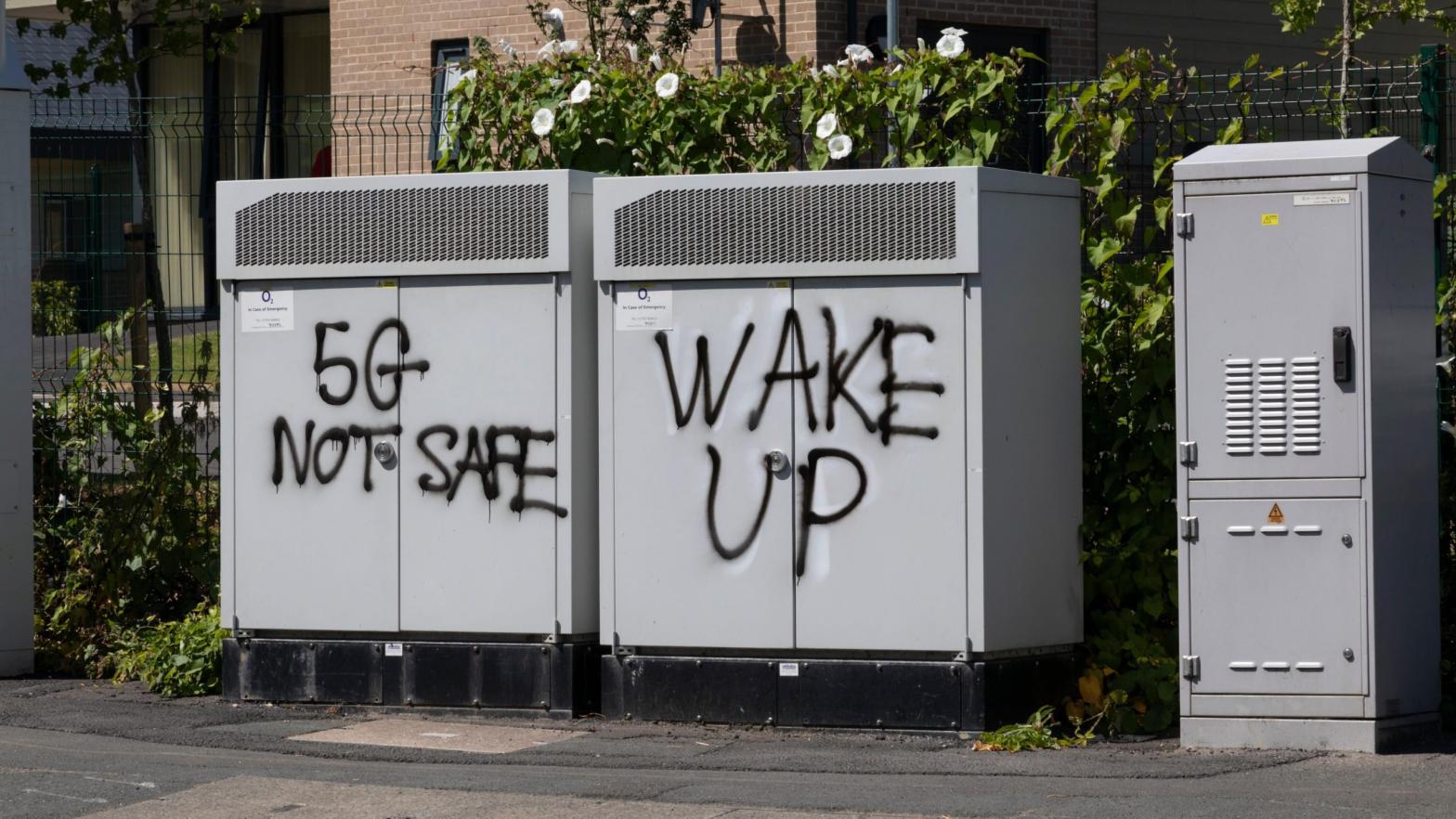 Graffiti on telecom equipment in Batley, the UK, promoting conspiracy theories about 5G connectivity technology in July 2021. (Photo: Daniel Harvey Gonzalez / In Pictures via Getty Images, Getty Images)