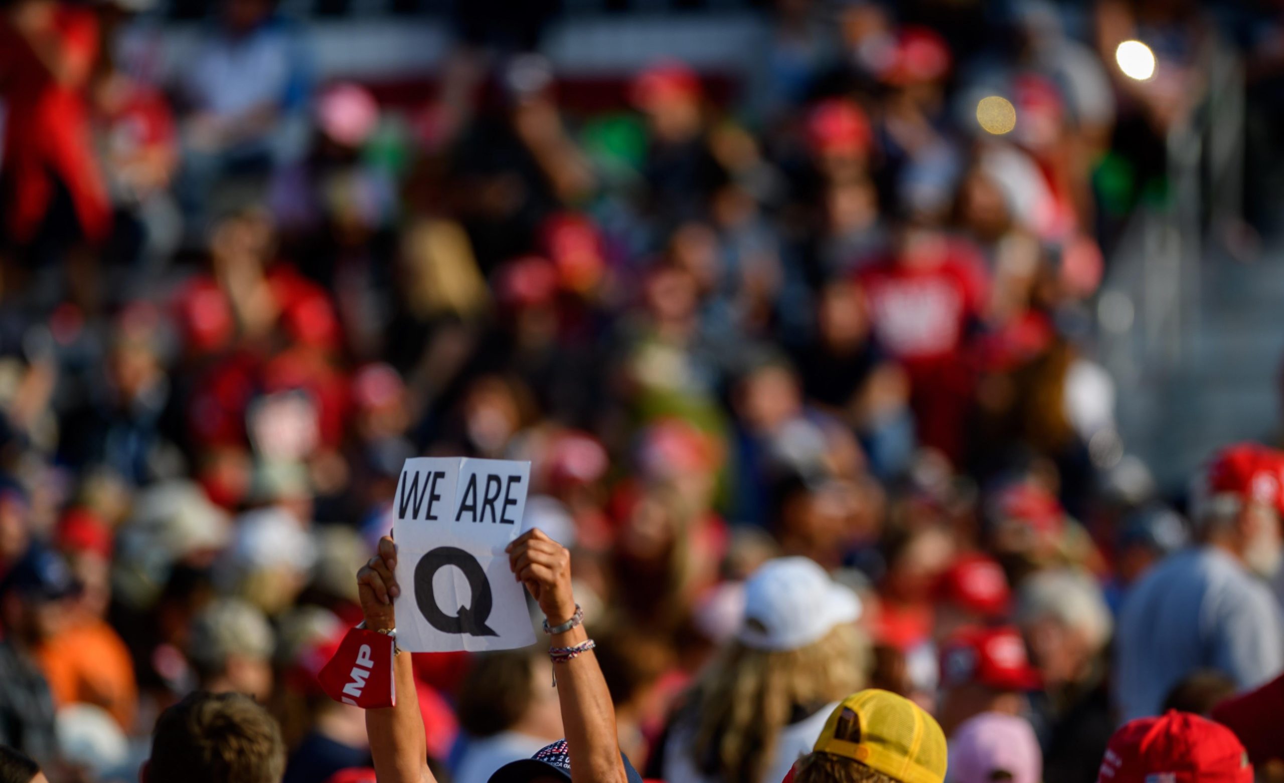 MOON TOWNSHIP, PA - SEPTEMBER 22: A woman holds up a QAnon sign to the media as attendees wait for President Donald Trump to speak at a campaign rally at Atlantic Aviation on September 22, 2020 in Moon Township, Pennsylvania.  (Photo: Jeff Swensen, Getty Images)