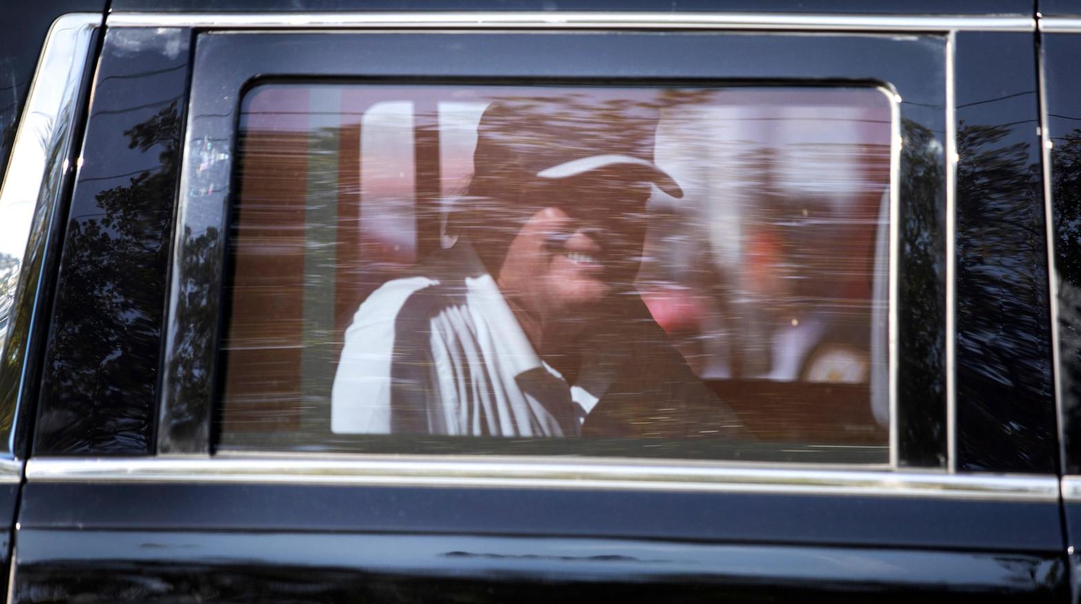 Trump grinning as he drives past supporters in West Palm Beach, Florida, on Feb. 15, 2021. (Photo: Joe Raedle, Getty Images)