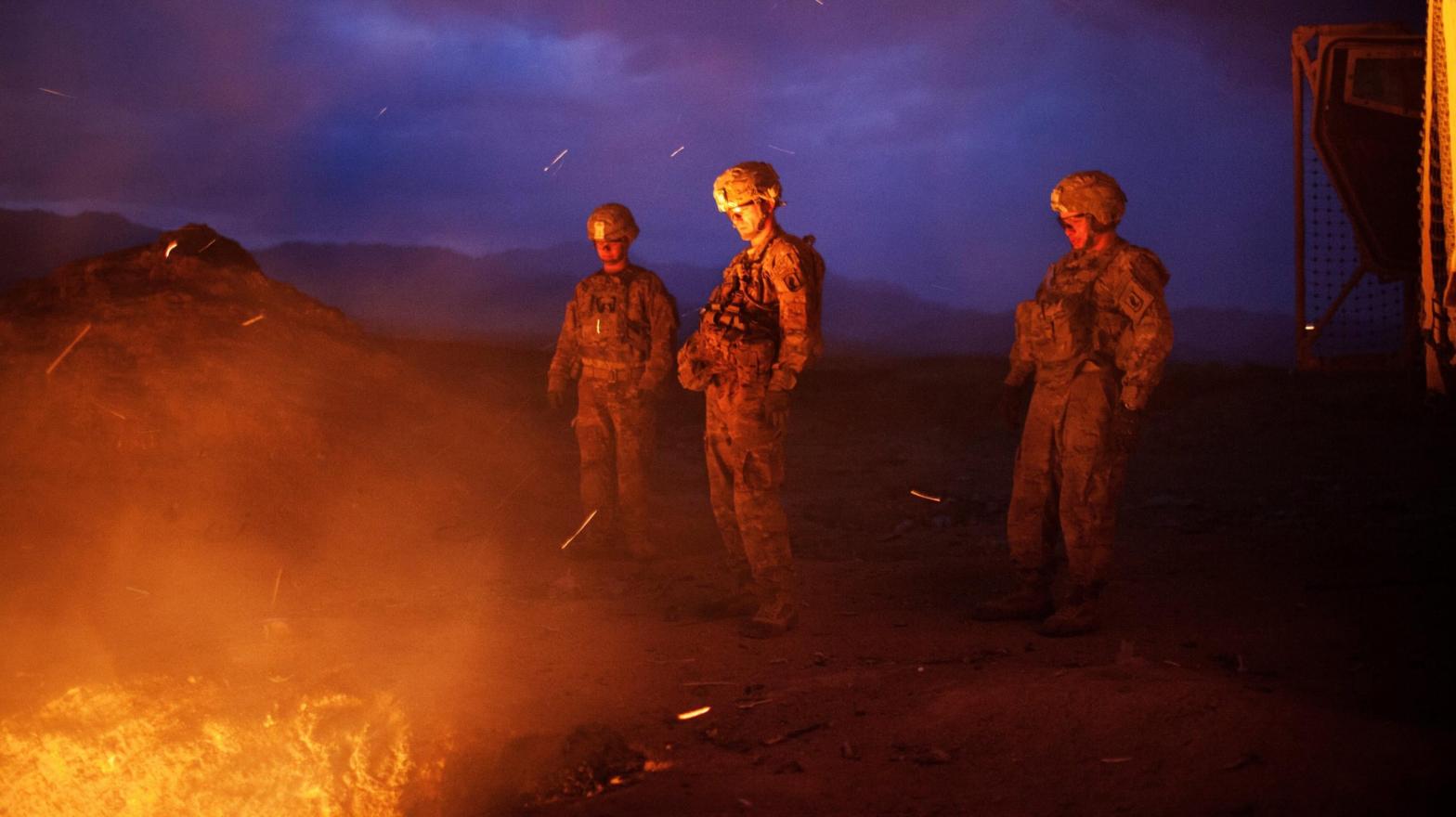 U.S. soldiers burn trash in a pit outside a base in Jaghatu, Afghanistan, in 2012. Military burn pits have been linked to cancers and other diseases among veterans. (Photo: Lorenzo Tugnoli for the Washington Post, Getty Images)