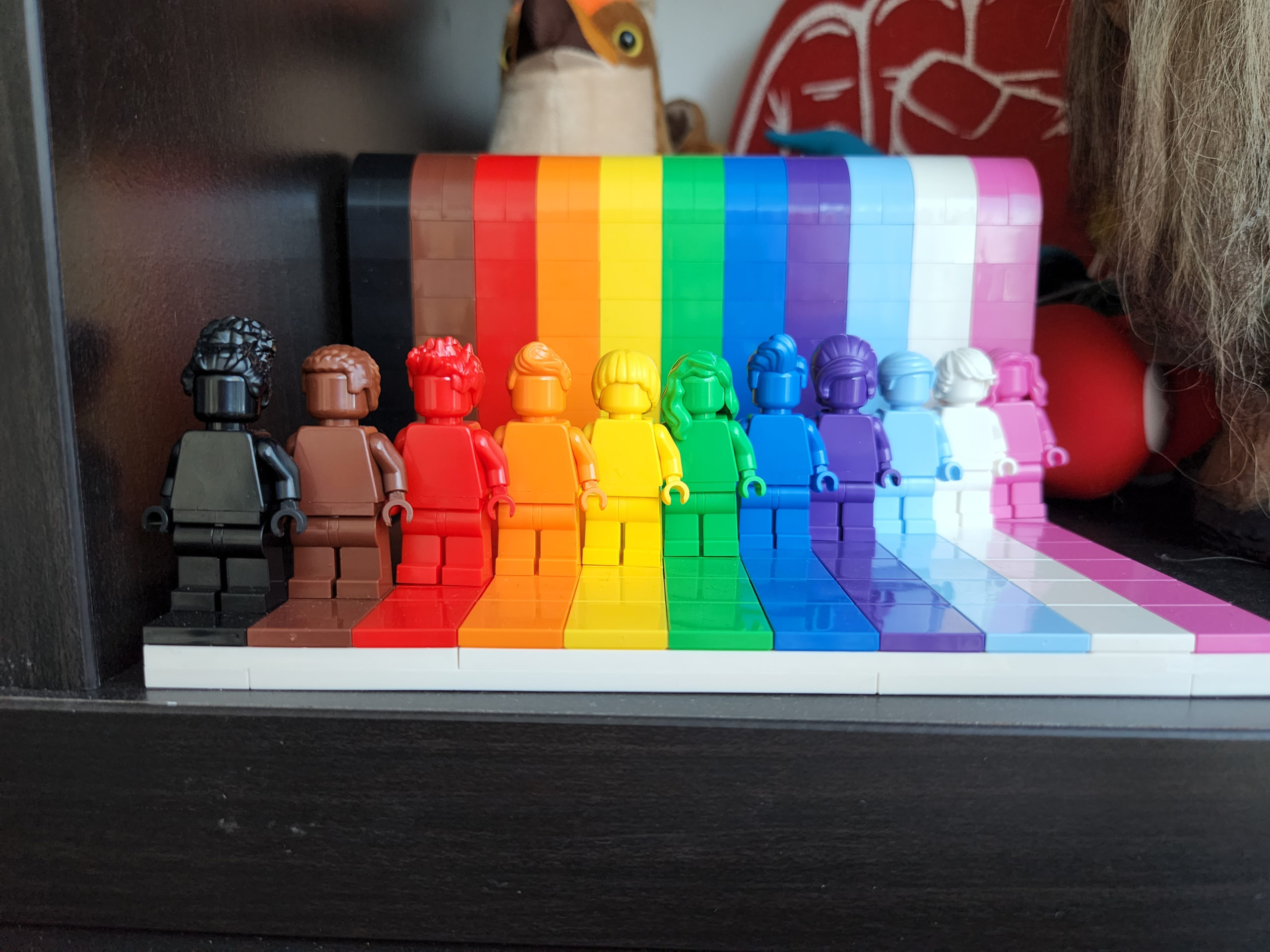 Rainbow Lego figures on a shelf