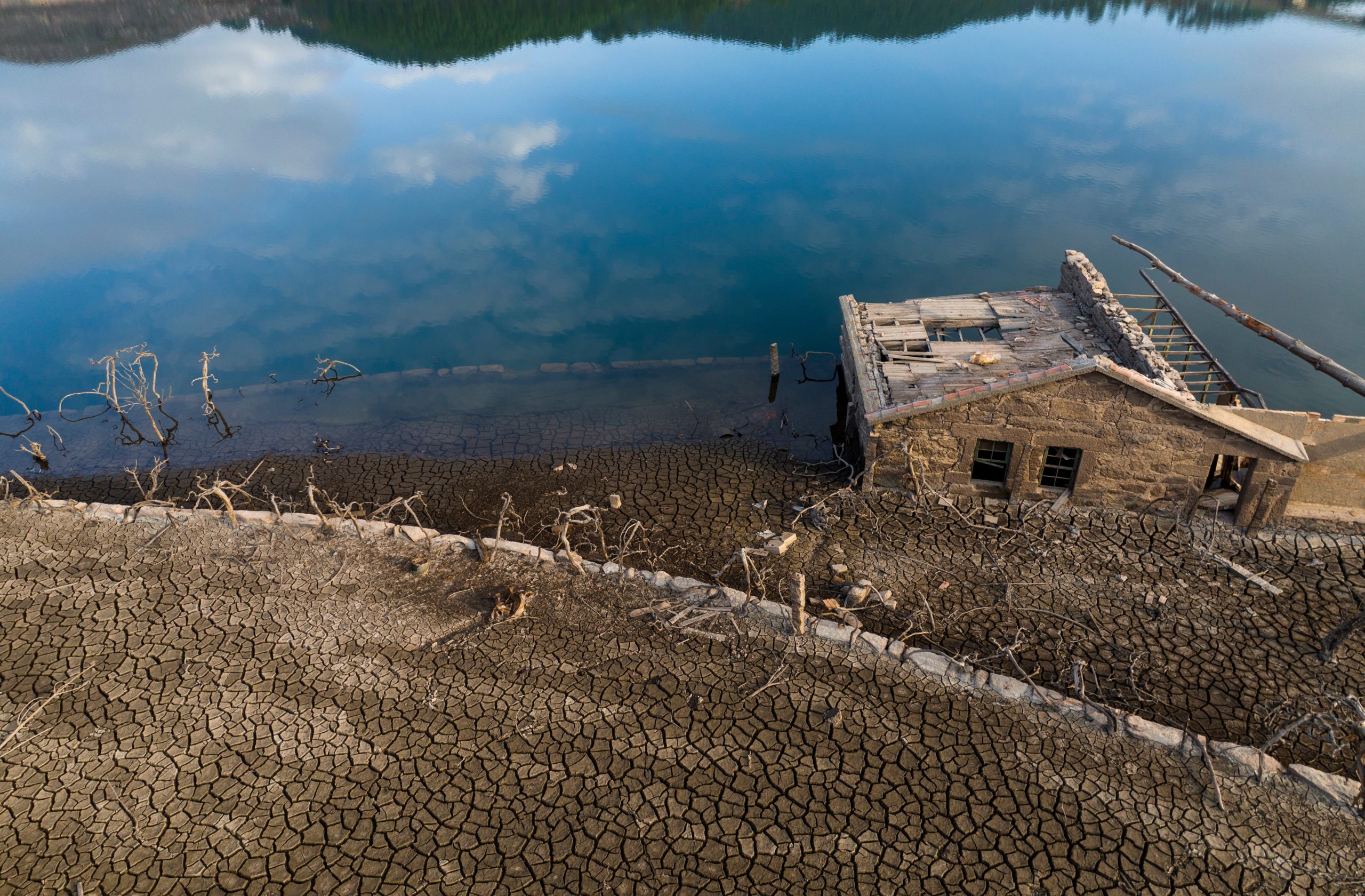 An old house, submerged three decades ago when a hydropower dam flooded the valley. (Photo: Emilio Morenatti, AP)