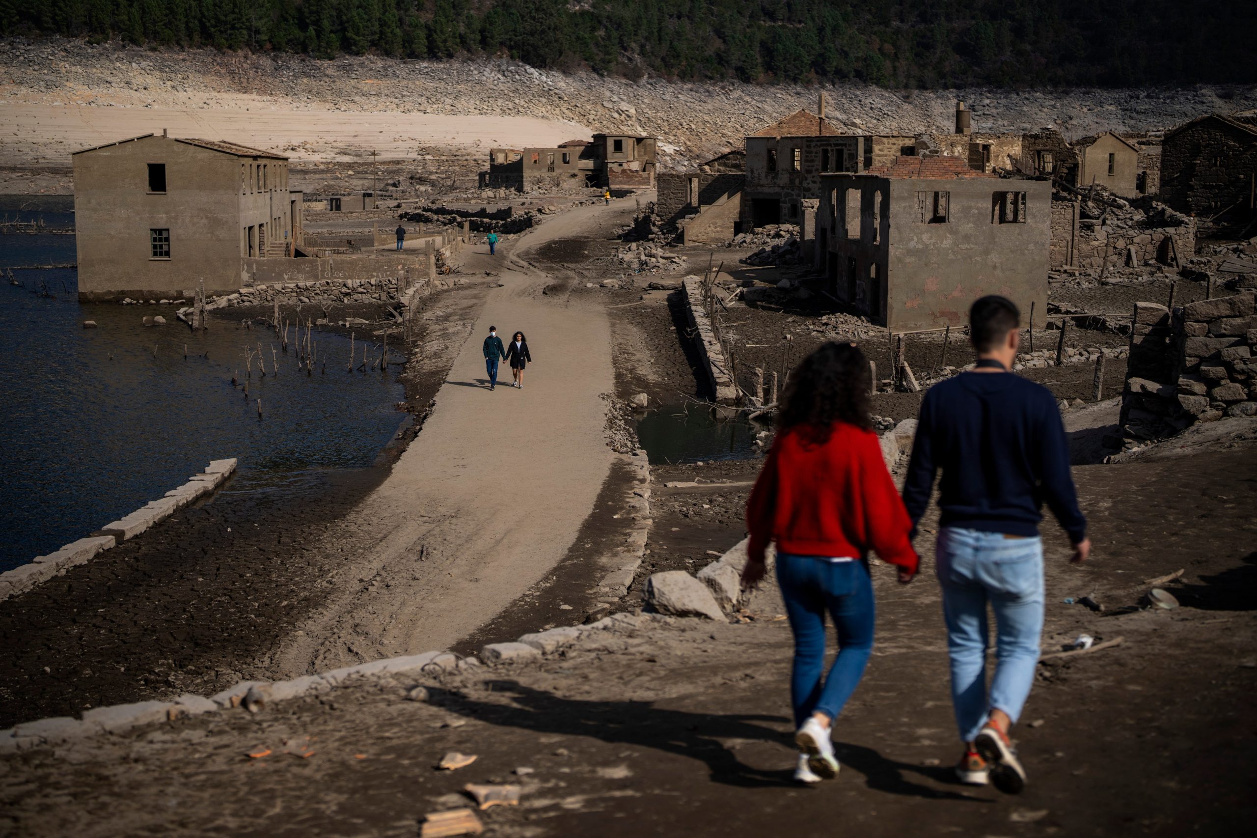 Visitors walk at the old village of Aceredo. (Photo: Emilio Morenatti, AP)