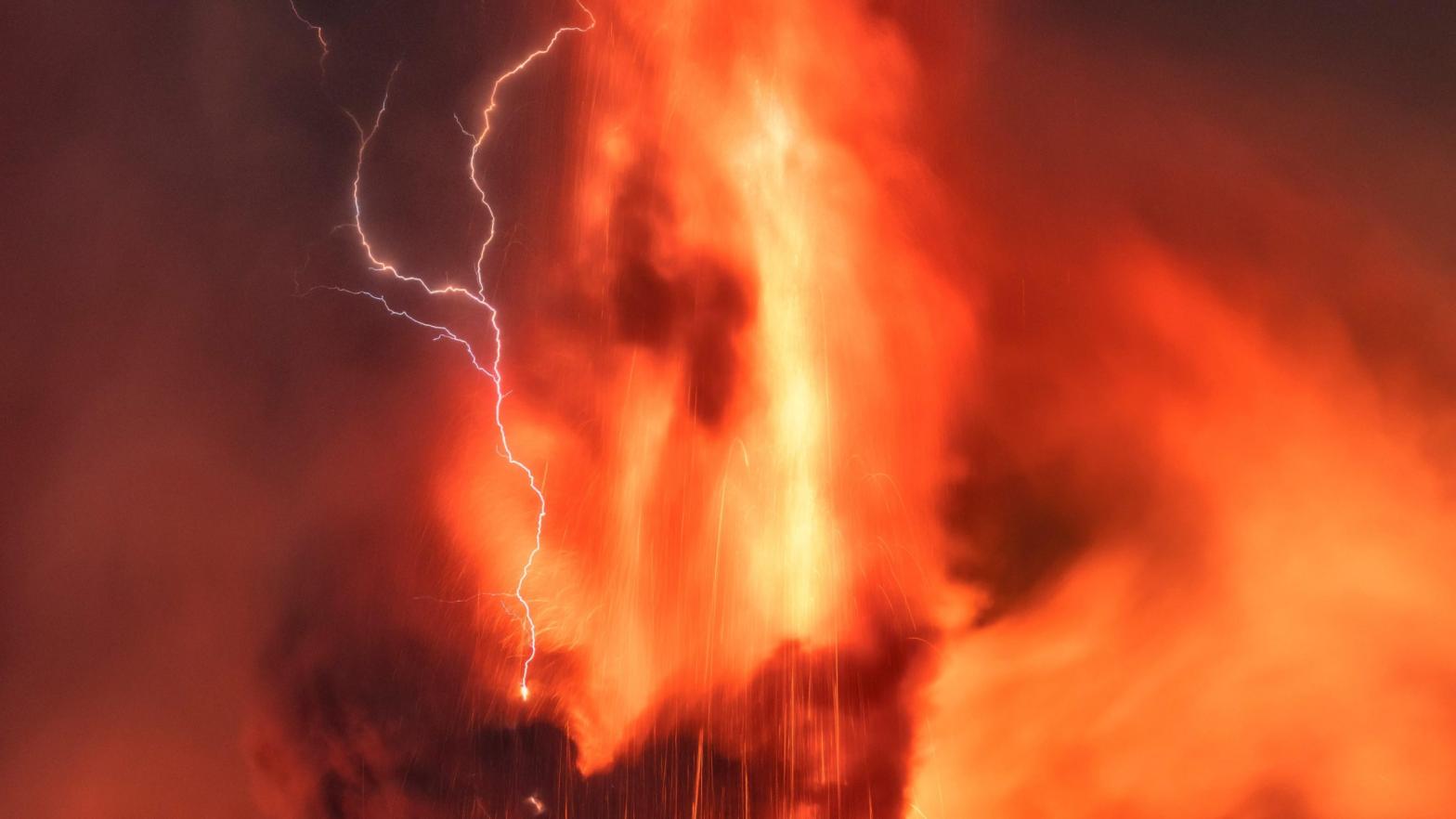 Volcanic lightning over Mount Etna in Sicily, Italy, during an eruption on Friday, Feb. 11, 2022.  (Photo: Emilio Messina, AP)