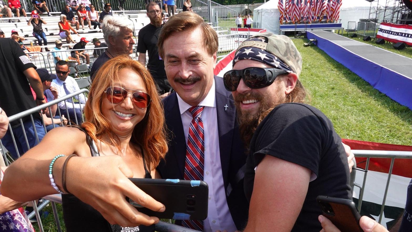 Mike Lindell, the CEO of MyPillow, taking selfies with Donald Trump supporters before a rally in Wellington, Ohio on June 26, 2021. (Photo: Scott Olson, Getty Images)