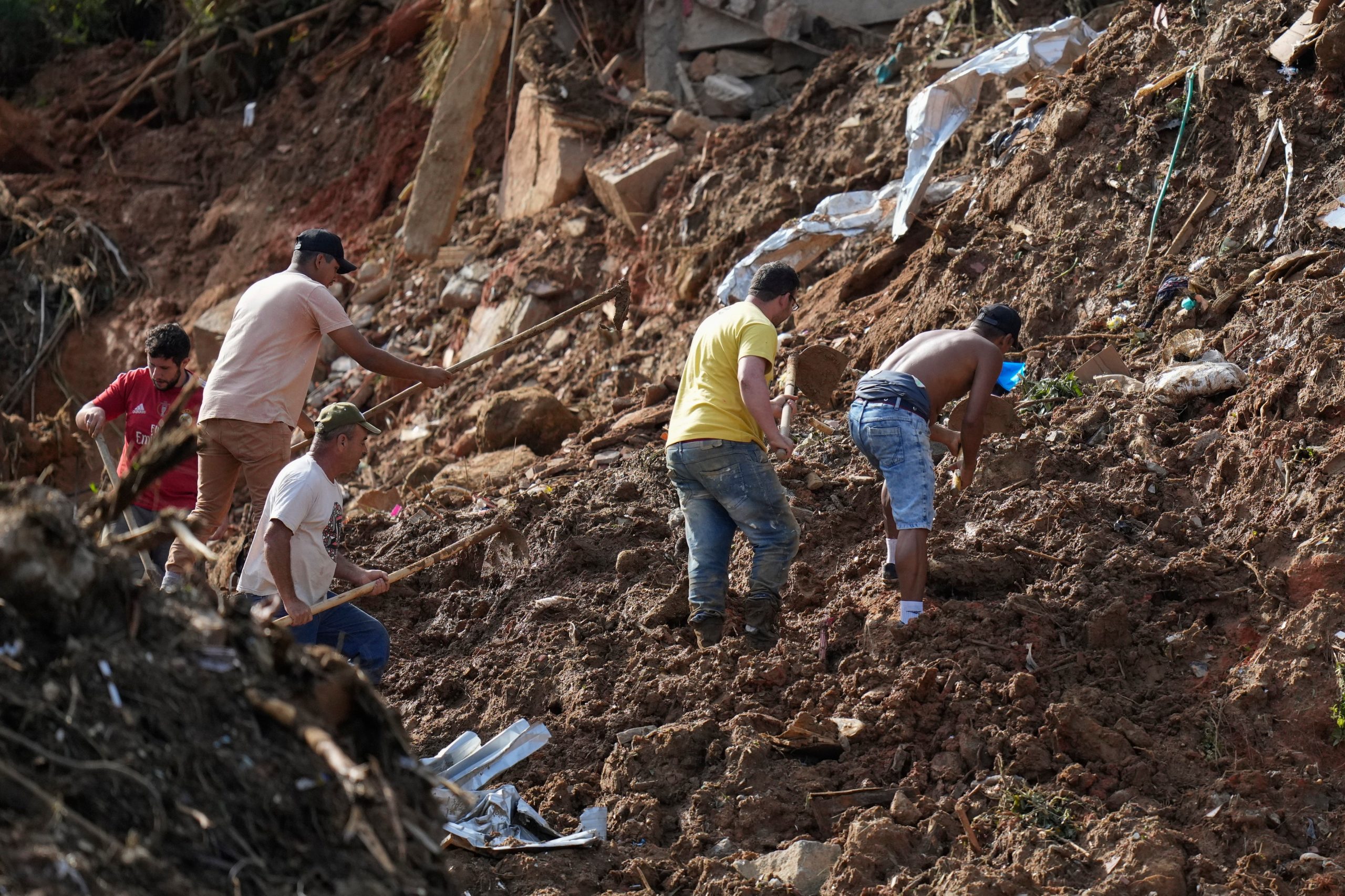 Residents search for survivors on the second day of rescue efforts. (Photo: Silvia Izquierdo, AP)