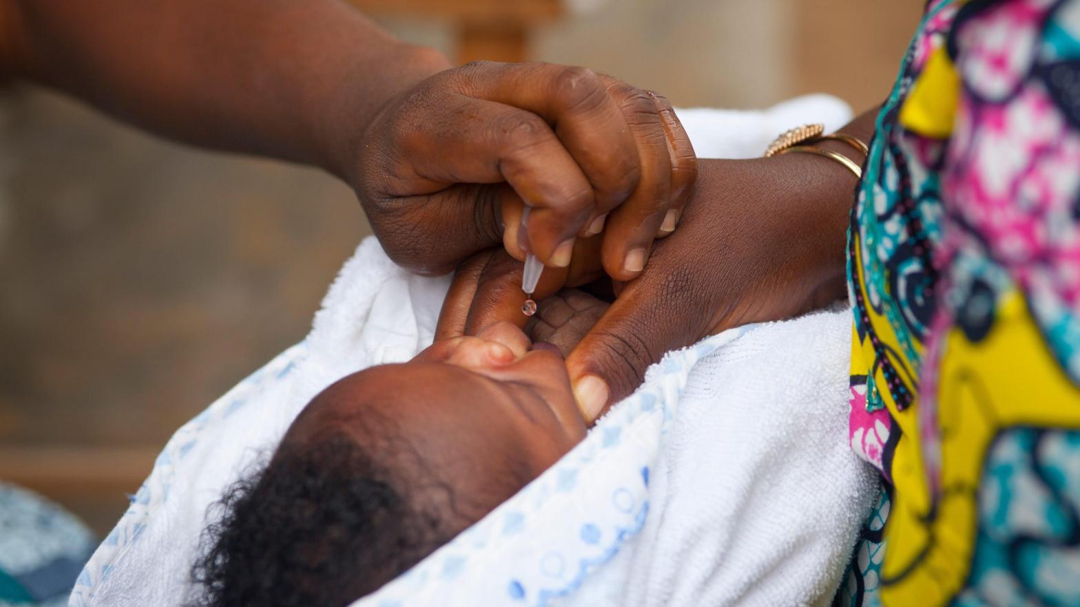 A child getting the oral polio vaccine at a health centre in Lome, Togo. (Photo: BSIP/Universal Images Group, Getty Images)