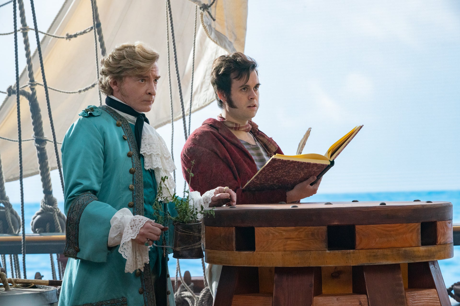 Captain Stede Bonnet (Rhys Darby) and crew member Lucius (Nathan Foad) aboard the Revenge. (Photo: Aaron Epstein/HBO Max)