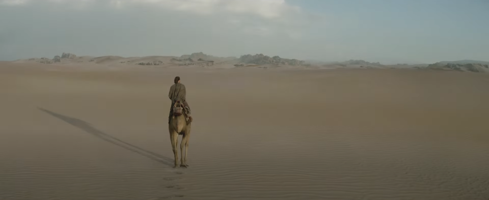 Obi-Wan wanders out into the dunes of his new home. (Screenshot: Lucasfilm)