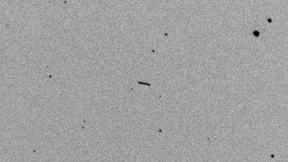 The asteroid, seen as the black streak at centre, approximately 13 minutes before it struck Earth.  (Image: Kleť Observatory)