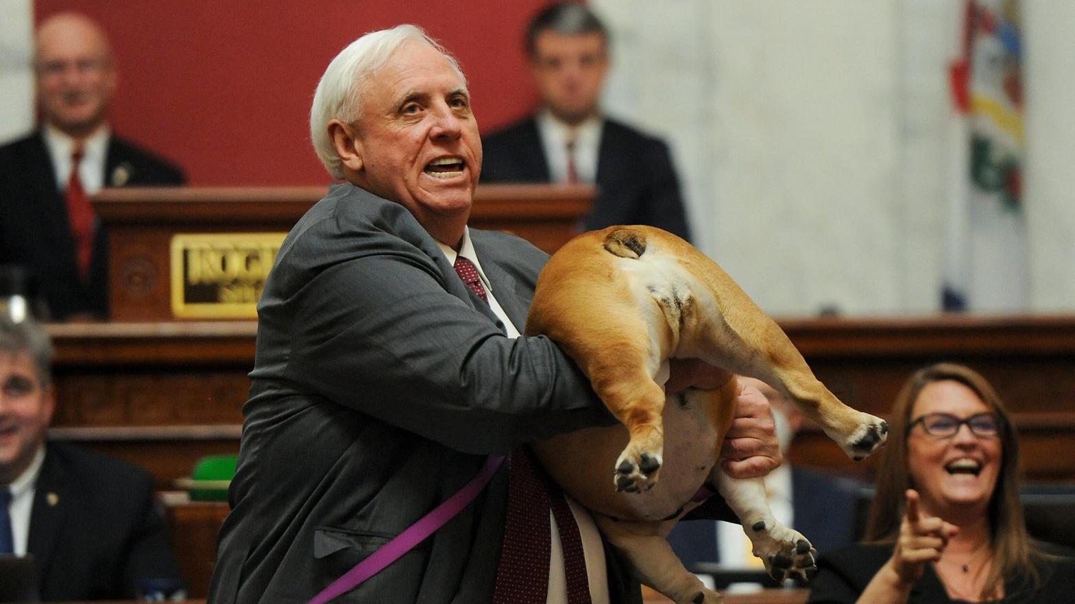 West Virginia Gov. Jim Justice holds up his dog on Jan. 27, 2022, in Charleston. (Photo: Chris Dorst/Charleston Gazette-Mai, AP)