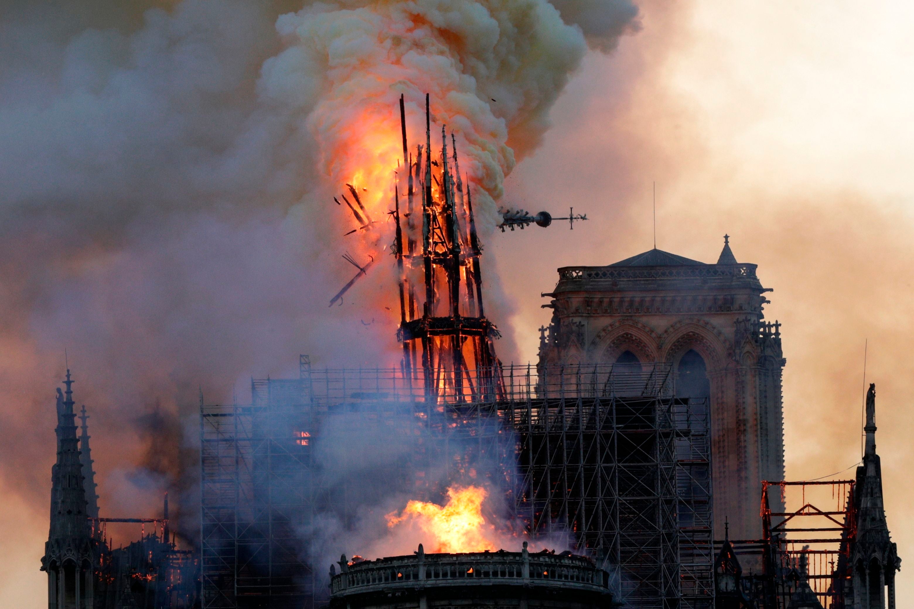 The collapse of Notre Dame's spire in a fire on April 15, 2019. (Photo: GEOFFROY VAN DER HASSELT/AFP, Getty Images)