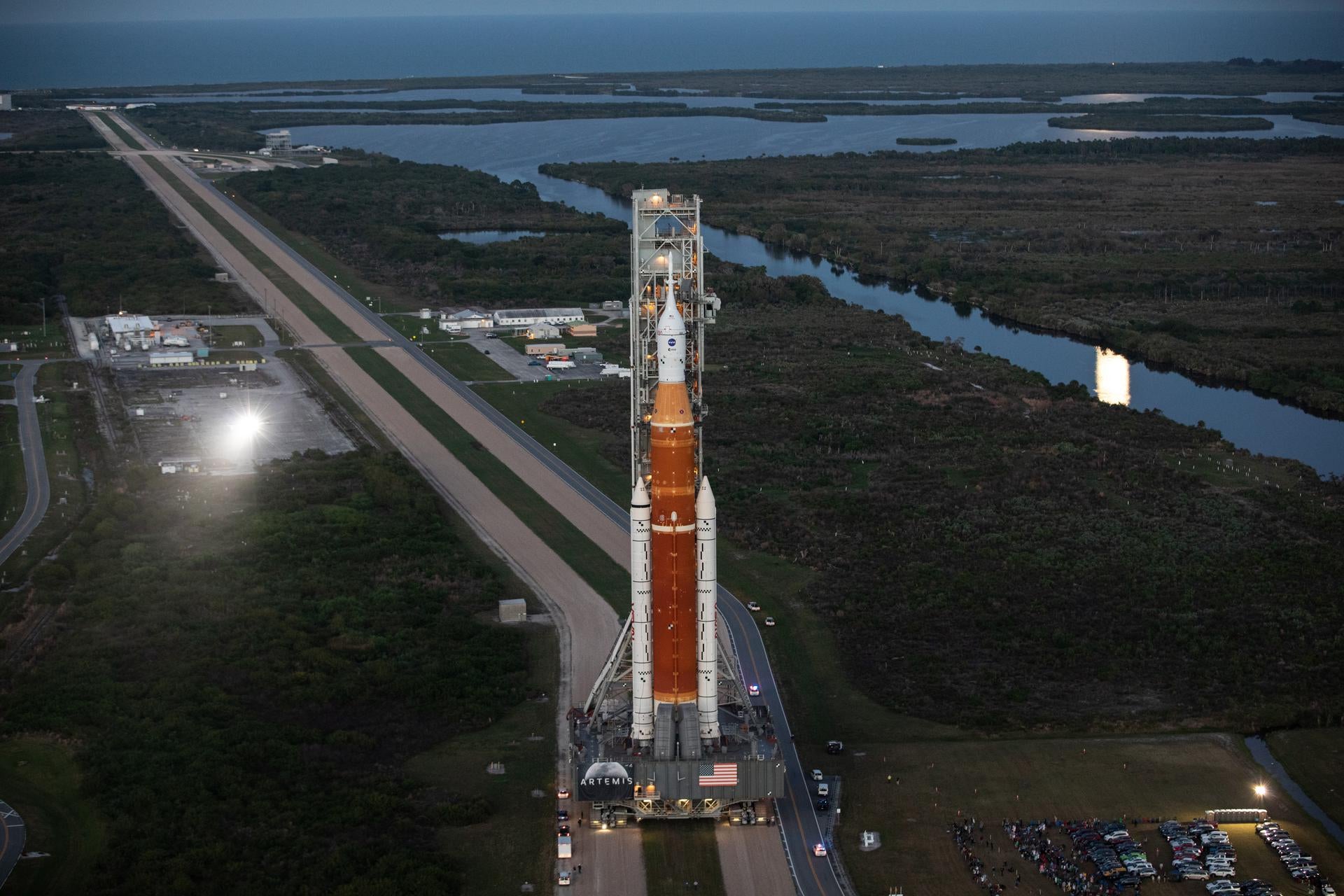 SLS — with the Orion crew capsule atop — slowly makes its way down the crawlerway at Kennedy Space Centre. (Photo: NASA/Kim Shiflett)