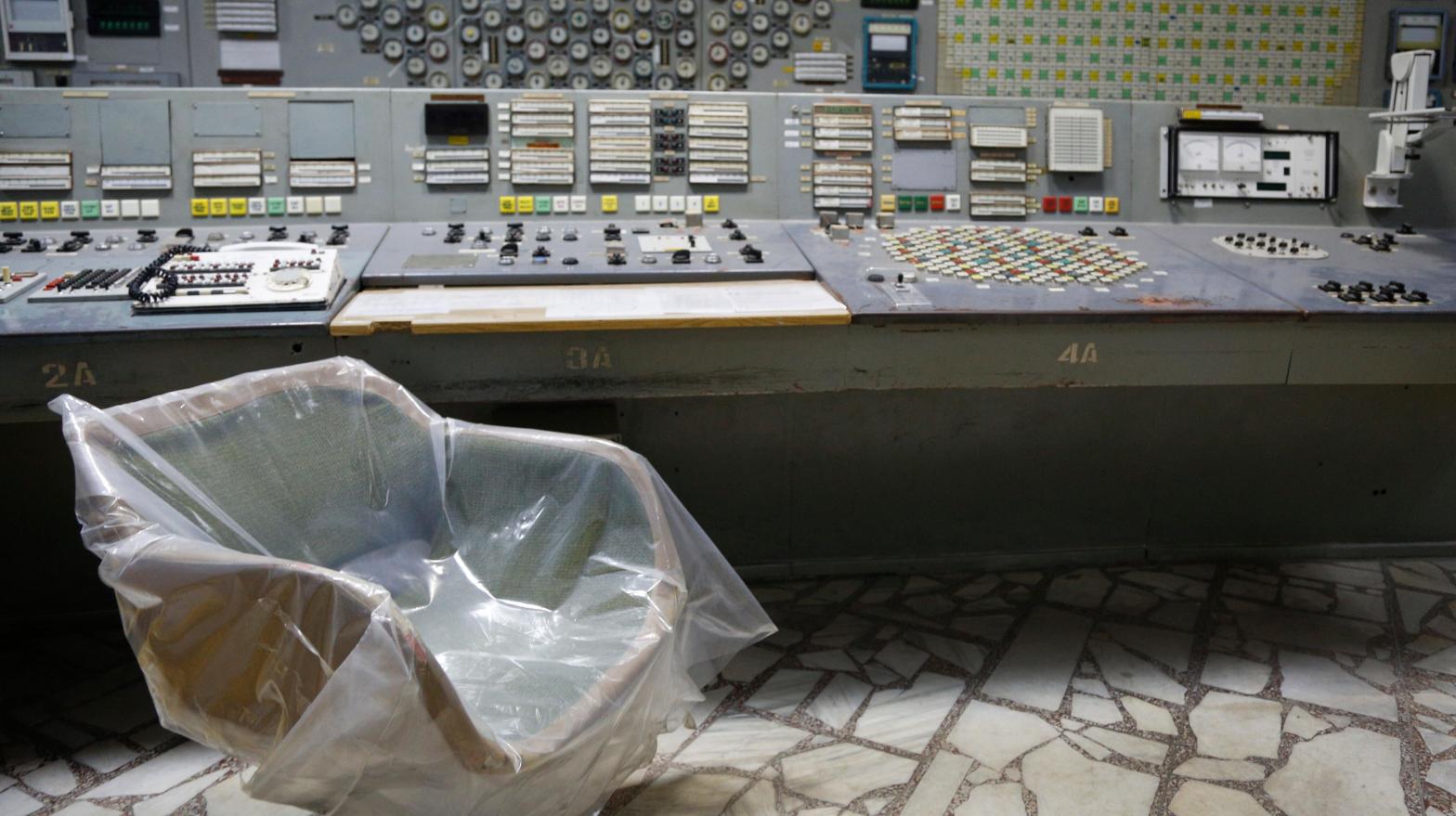 An operator's arm-chair covered with plastic sits in an empty control room of the 3rd reactor at the Chernobyl nuclear plant, in Chernobyl, Ukraine, on April 20, 2018.  (Photo: Efrem Lukatsky, AP)