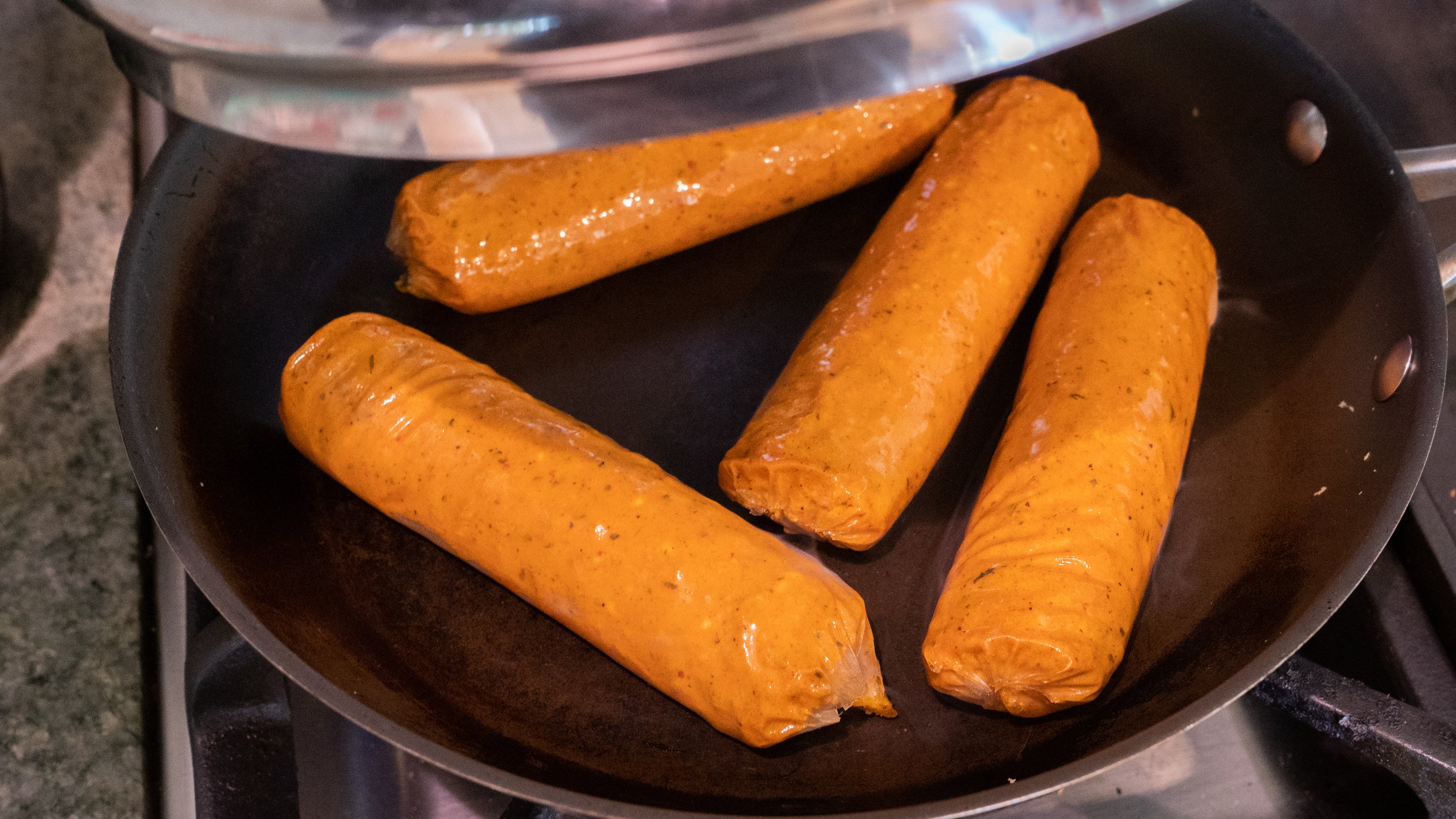These lumpy veggie dogs look more appetizing once they're browned.  (Photo: Florence Ion / Gizmodo)