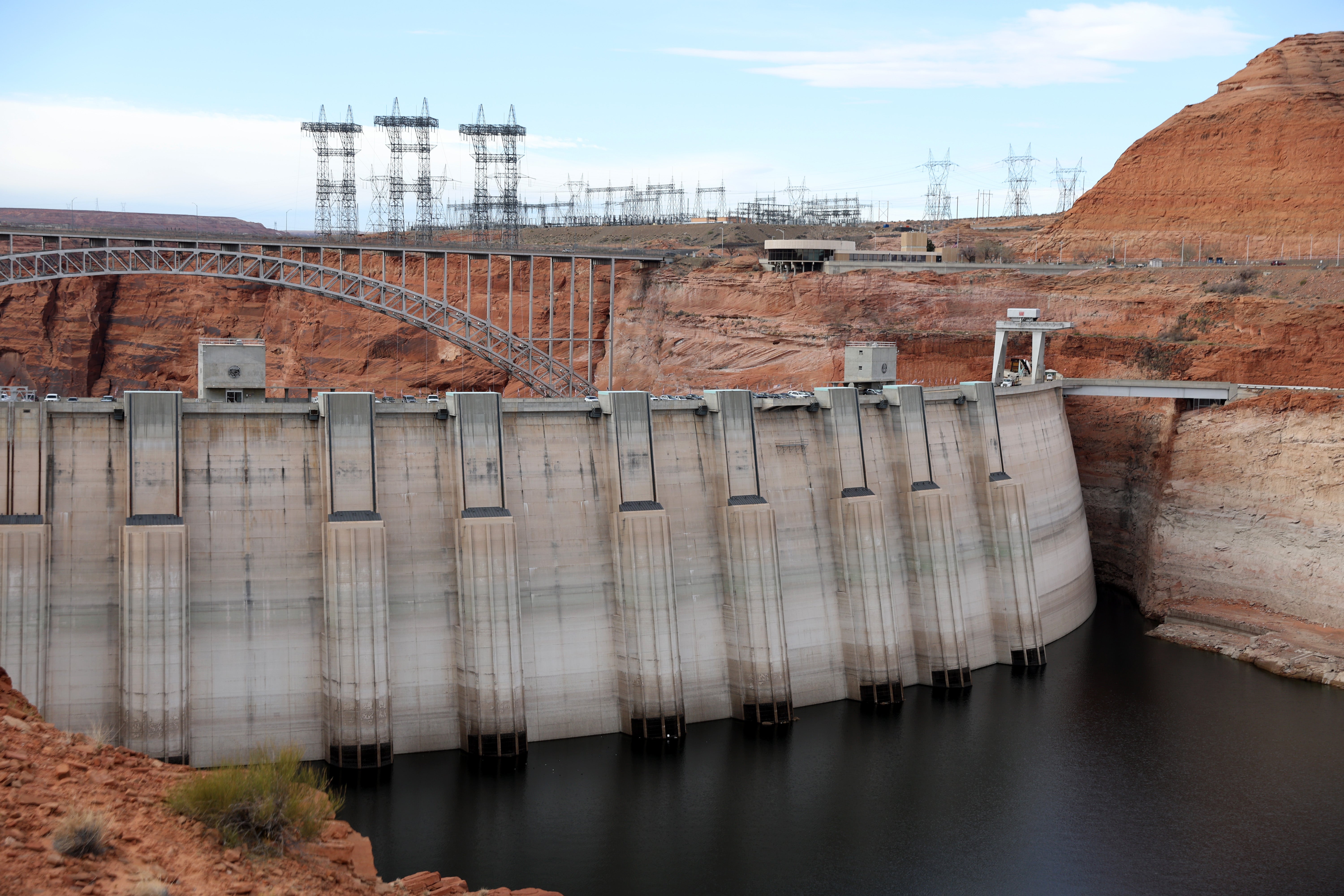 Electrical transmission towers stand near the Glen Canyon Dam at Lake Powell on March 28, 2022 in Page, Arizona.  (Photo: Justin Sullivan, Getty Images)
