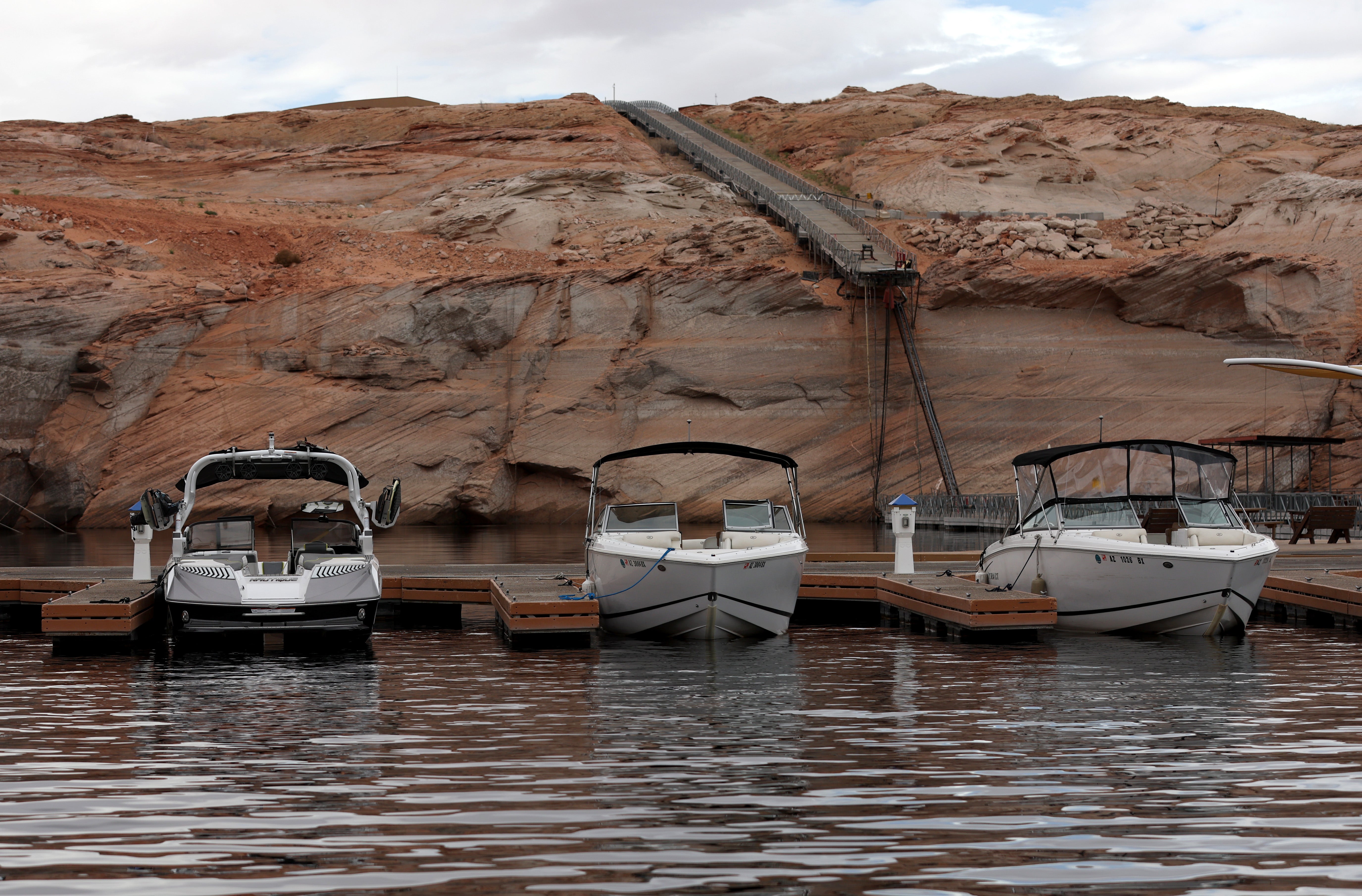 Boats sit docked near a ramp that falls short of the water at Lake Powell, (Photo: Justin Sullivan, Getty Images)