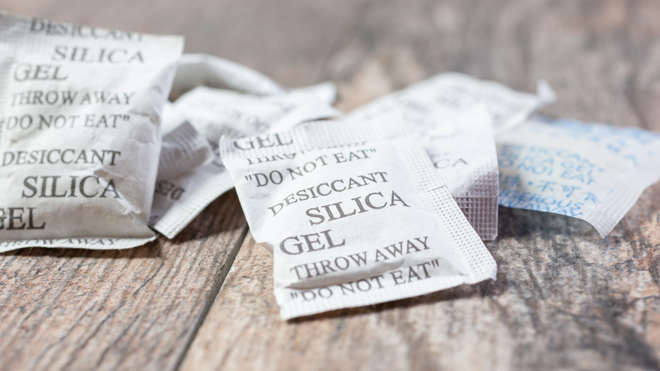 Silica gel packets are a great alternative a camera cabinet